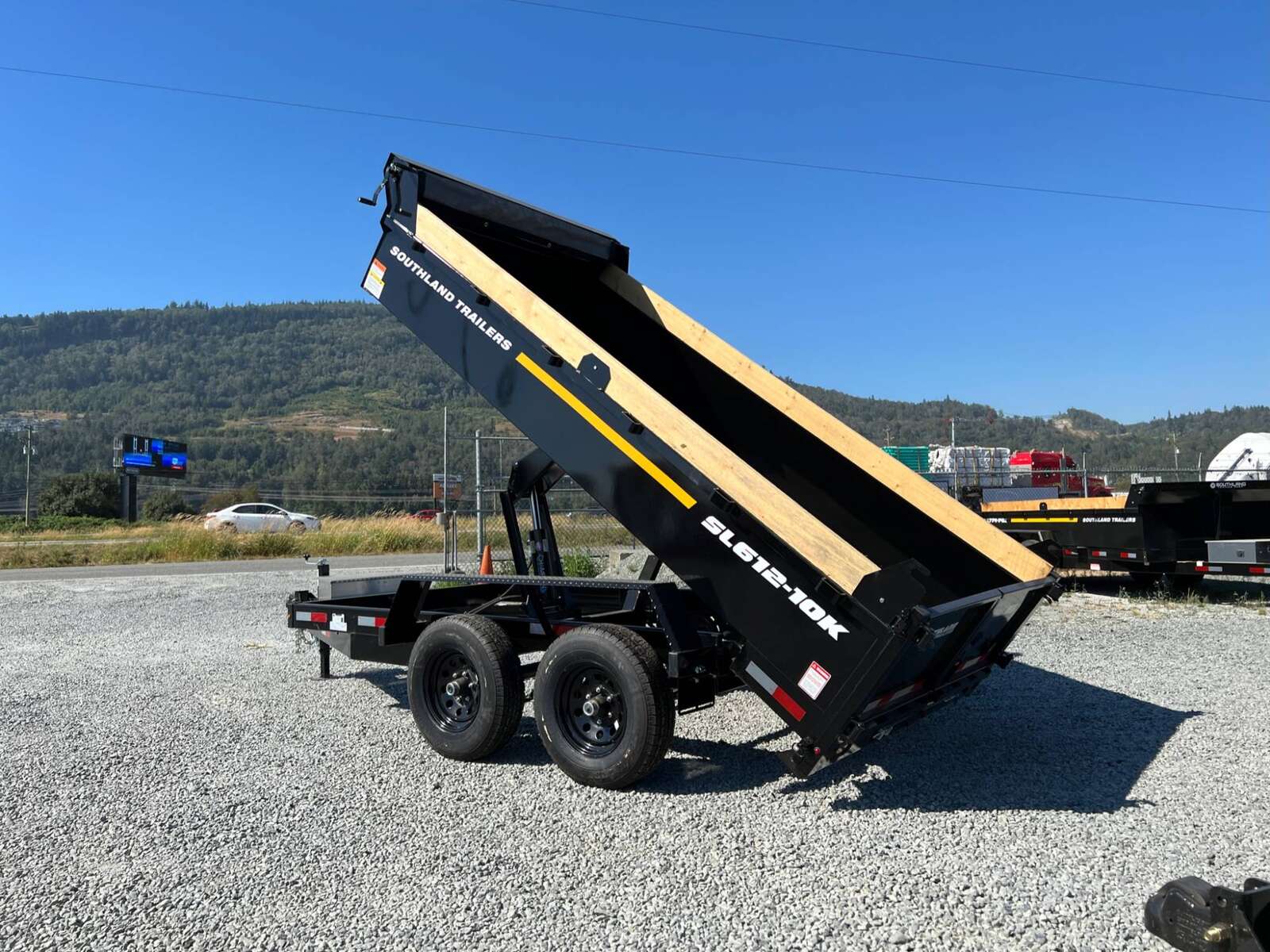 Photo of 2025 Southland 6X12 Dump Trailer 11,400LB GVW with Tarp and Ramps