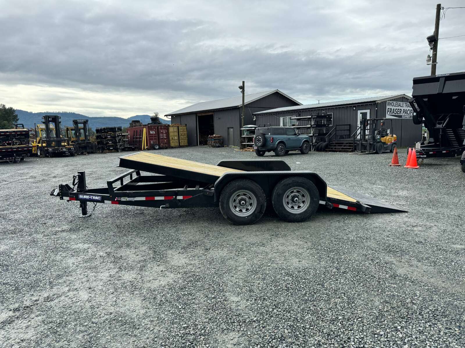 Photo of New Suretrac 7x16 HD Tilt Deck Equipment Trailer 14,000lb GVW