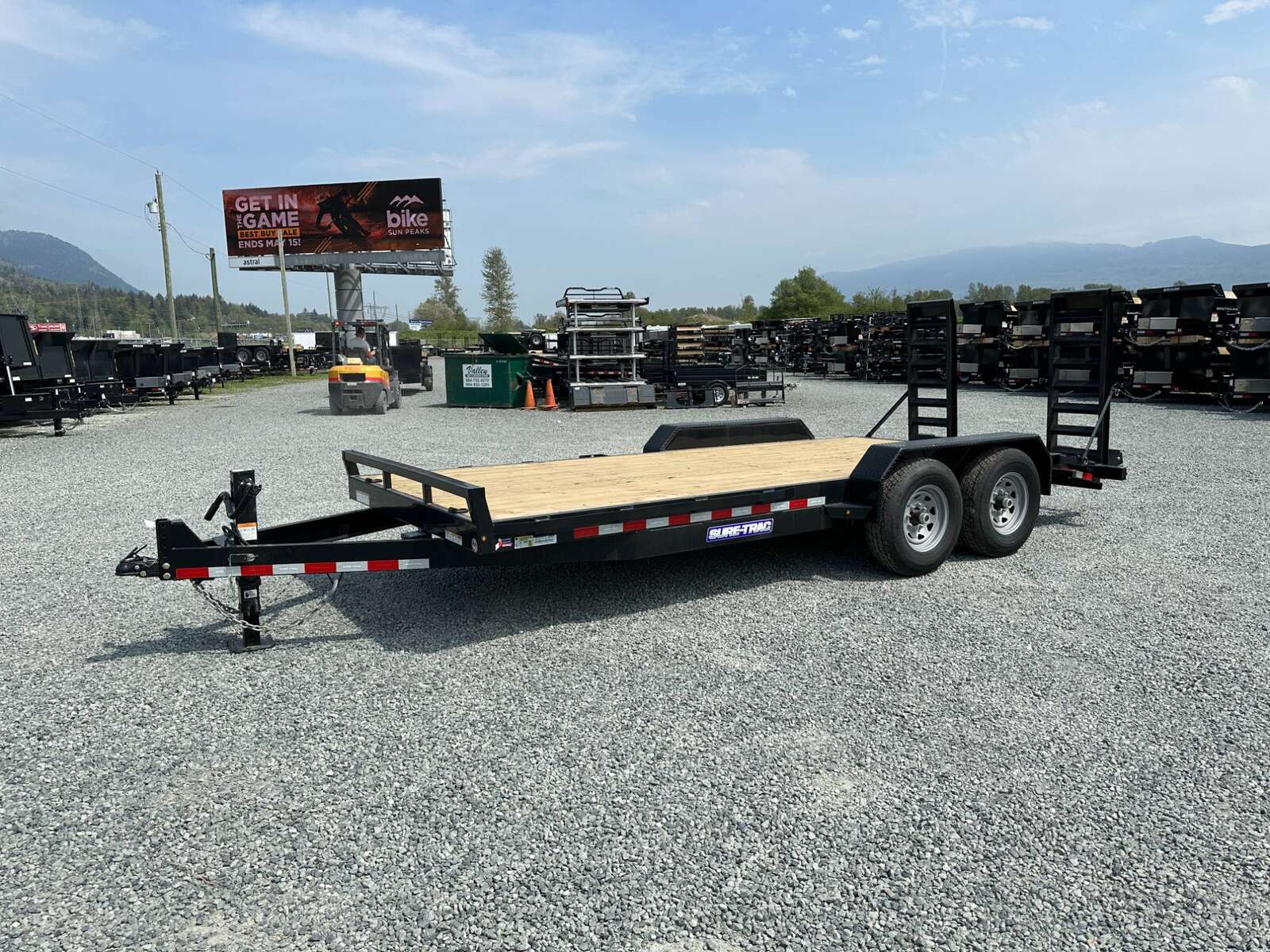 Photo of 2025 Suretrac 7x18 Equipment Trailer 14,000LB GVW Implement Flat Deck w/ Stand Up Ramps