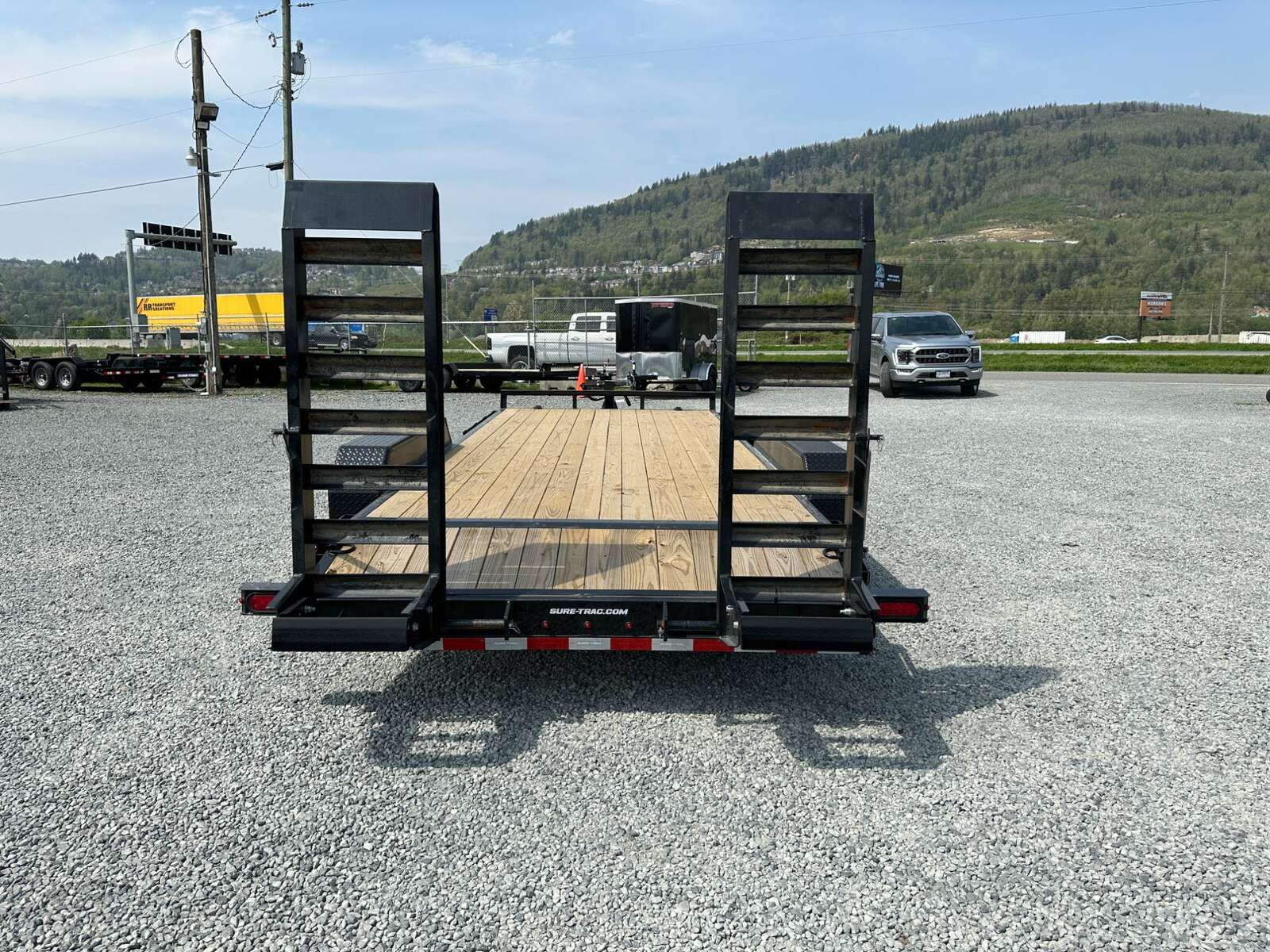 Photo of 2025 Suretrac 7x18 Equipment Trailer 14,000LB GVW Implement Flat Deck w/ Stand Up Ramps