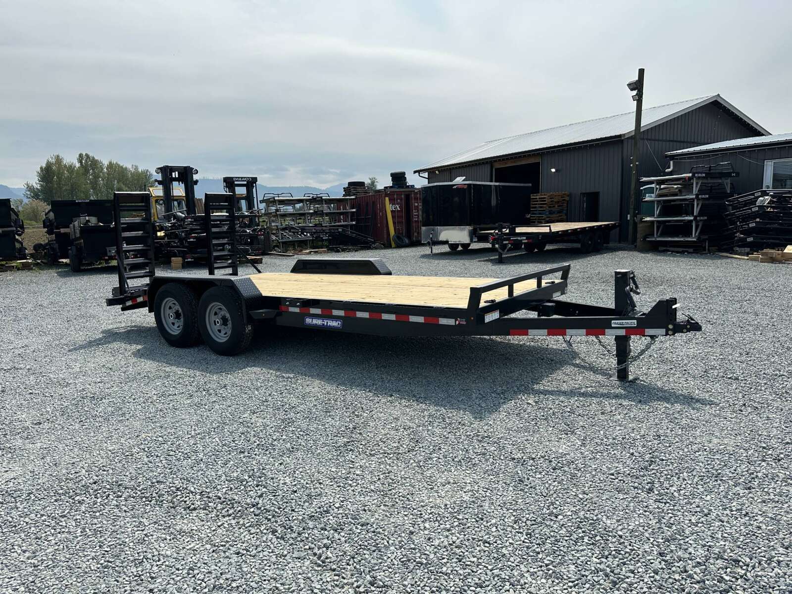 Photo of 2025 Suretrac 7x18 Equipment Trailer 14,000LB GVW Implement Flat Deck w/ Stand Up Ramps