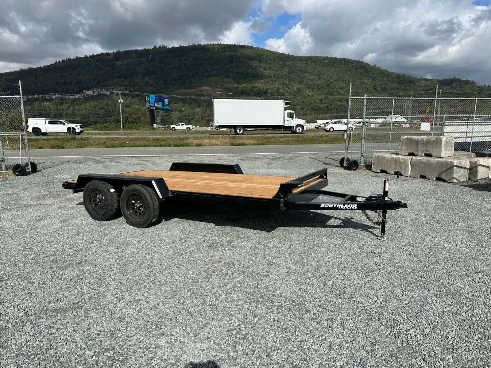 Photo of 2024 Southland 7X14 FLATBED TRAILER FLAT DECK 7,700LB GVW w/ Slide in ramps