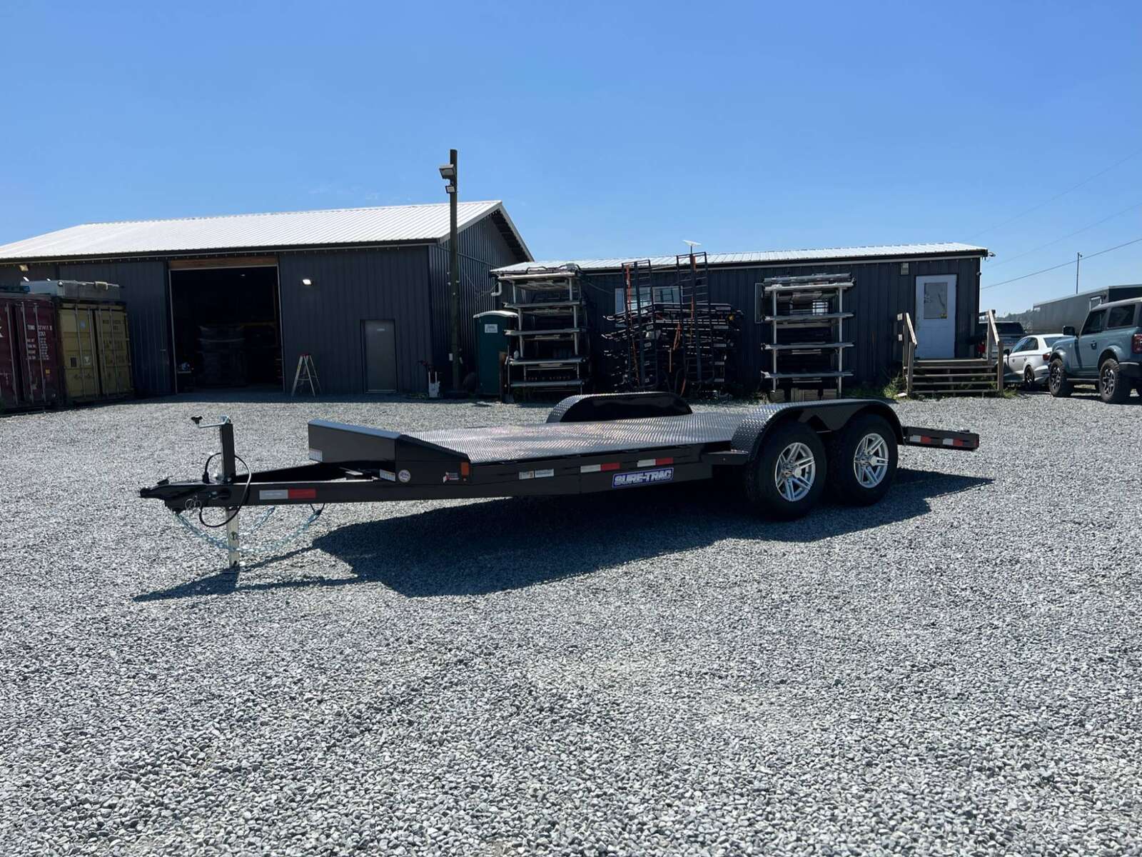 Photo of New Suretrac 7x18 ft Steel Deck Car Hauler Dovetail 9,900lb GVW Flat Deck w/ Slide Out Ramps