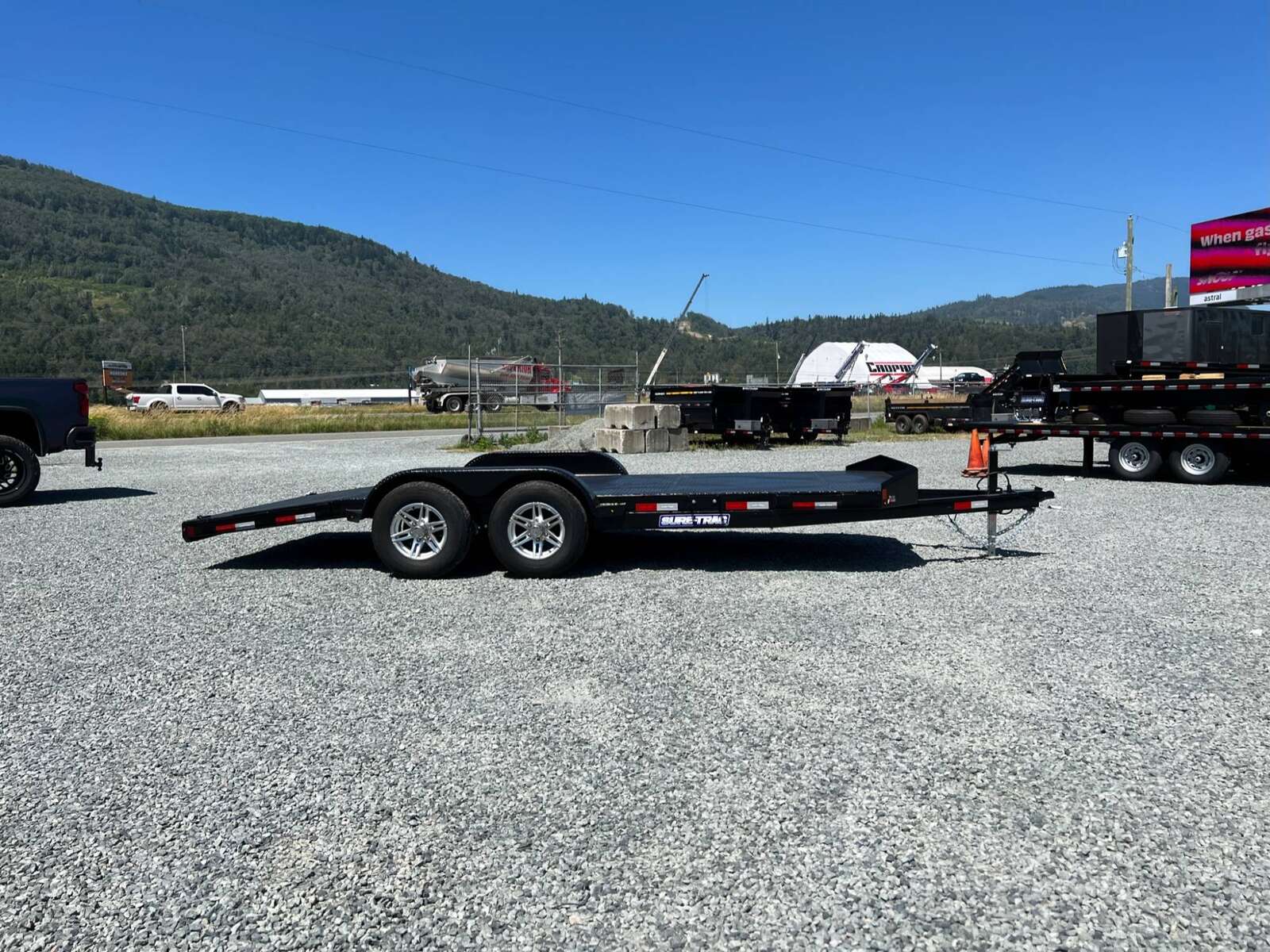 Photo of New Suretrac 7x18 ft Steel Deck Car Hauler Dovetail 9,900lb GVW Flat Deck w/ Slide Out Ramps