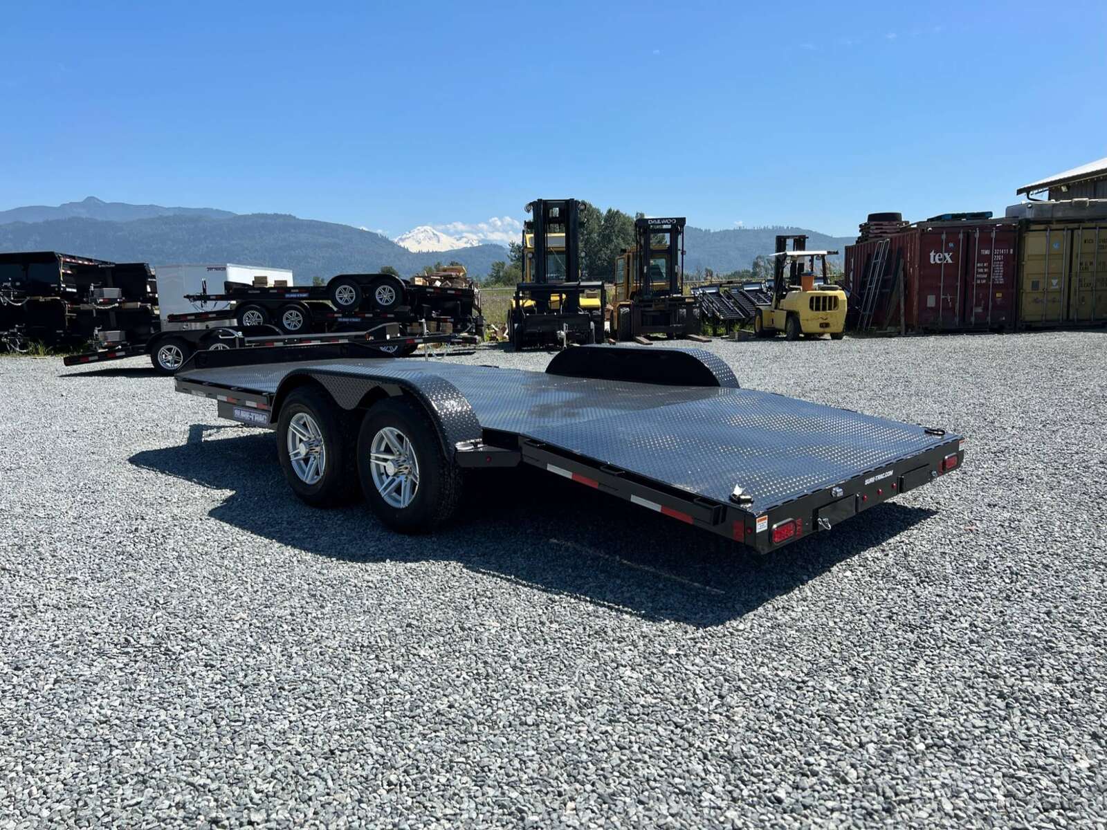 Photo of New Suretrac 7x18 ft Steel Deck Car Hauler Dovetail 9,900lb GVW Flat Deck w/ Slide Out Ramps