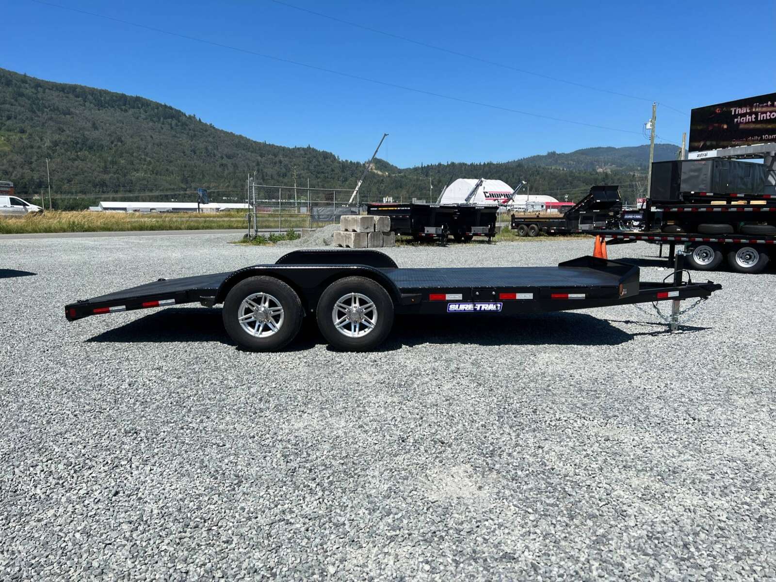 Photo of New Suretrac 7x18 ft Steel Deck Car Hauler Dovetail 9,900lb GVW Flat Deck w/ Slide Out Ramps