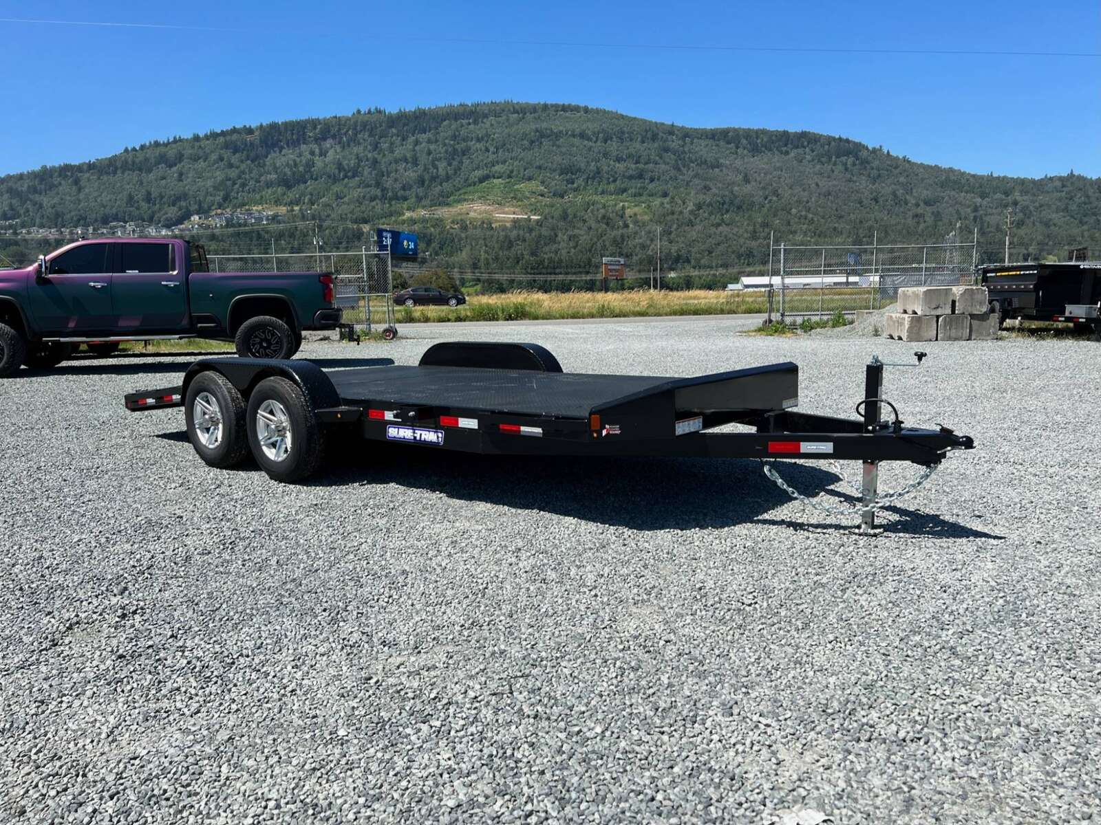 Photo of New Suretrac 7x18 ft Steel Deck Car Hauler Dovetail 9,900lb GVW Flat Deck w/ Slide Out Ramps