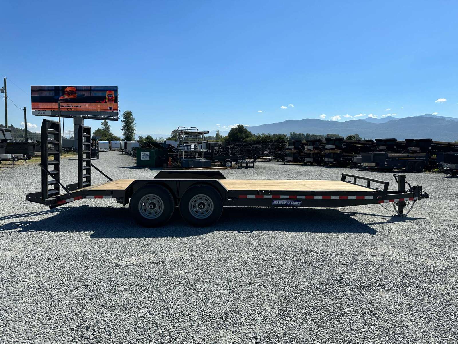 Photo of 2025 Suretrac 7x20 Equipment Trailer 14,000LB GVW Implement Flat Deck w/ Stand Up Ramps