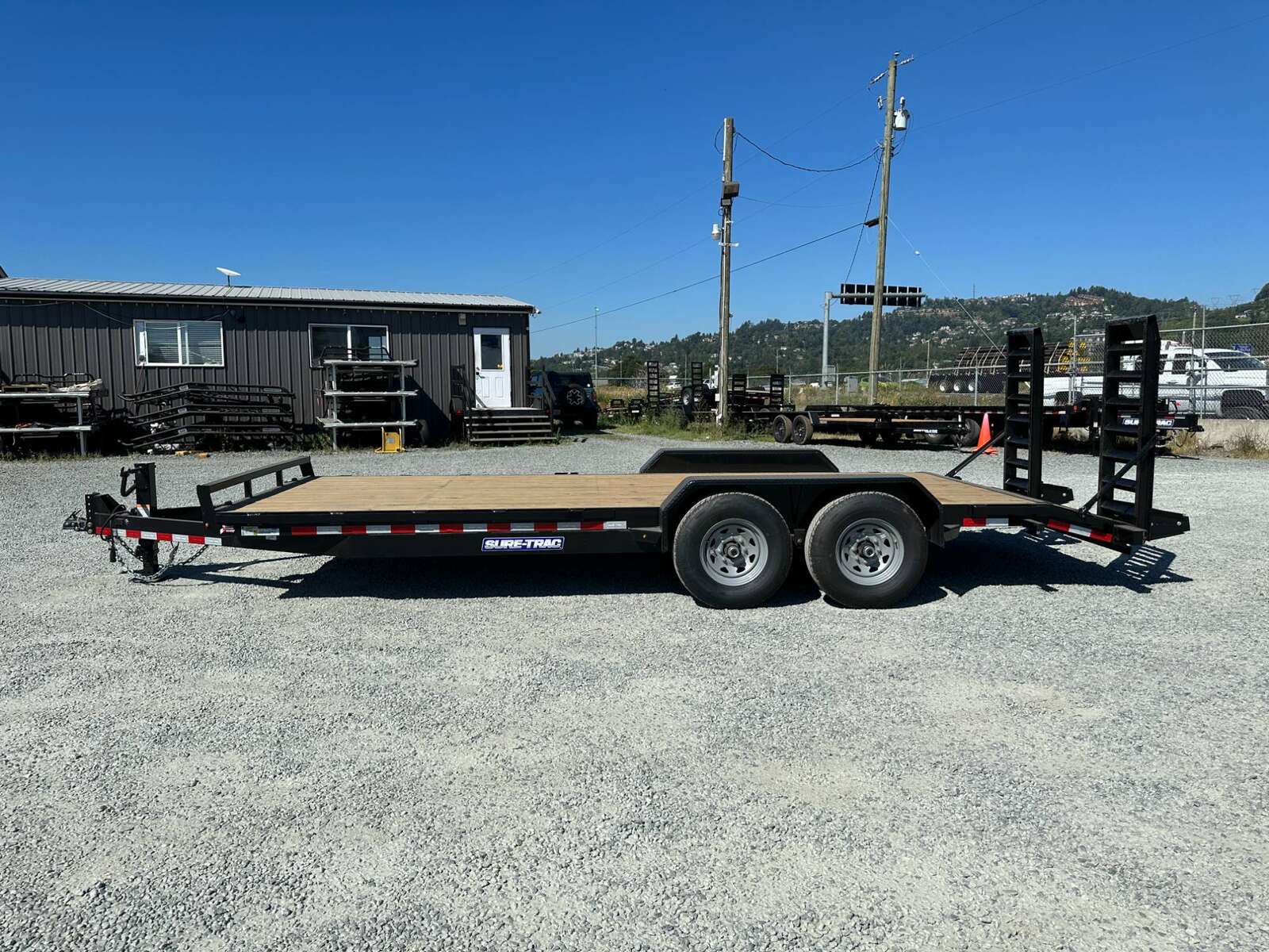 Photo of 2025 Suretrac 7x20 Equipment Trailer 14,000LB GVW Implement Flat Deck w/ Stand Up Ramps