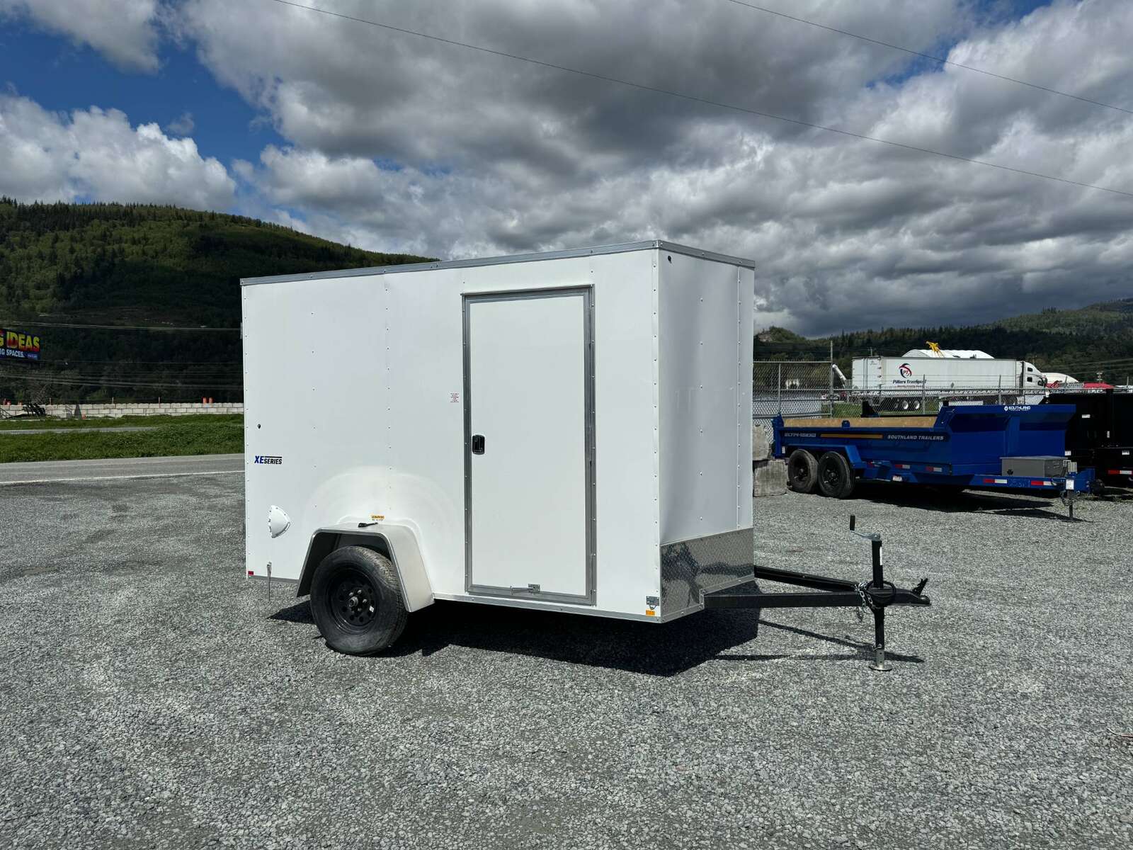 Photo of 2025 Mirage XE 6x10 V Nose Enclosed Cargo Trailer Barn Doors White Extra Height 2990lb GVW