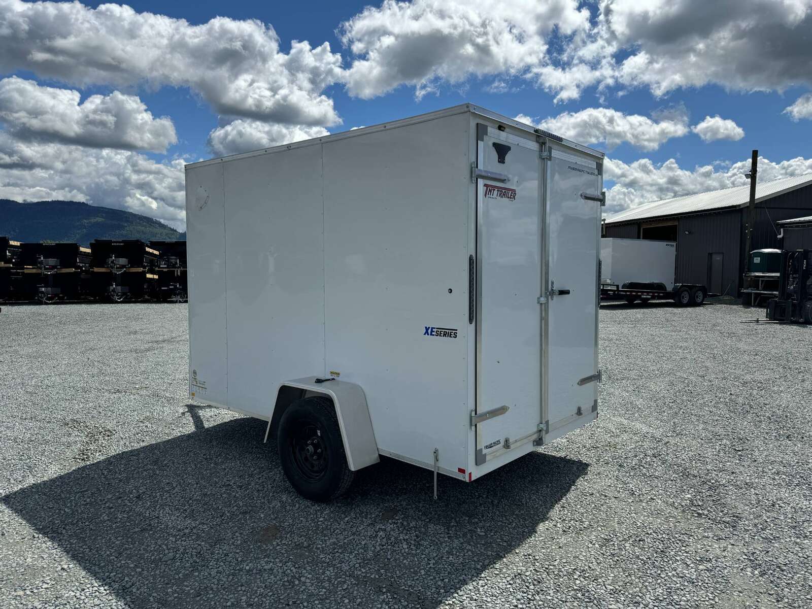 Photo of 2025 Mirage XE 6x10 V Nose Enclosed Cargo Trailer Barn Doors White Extra Height 2990lb GVW