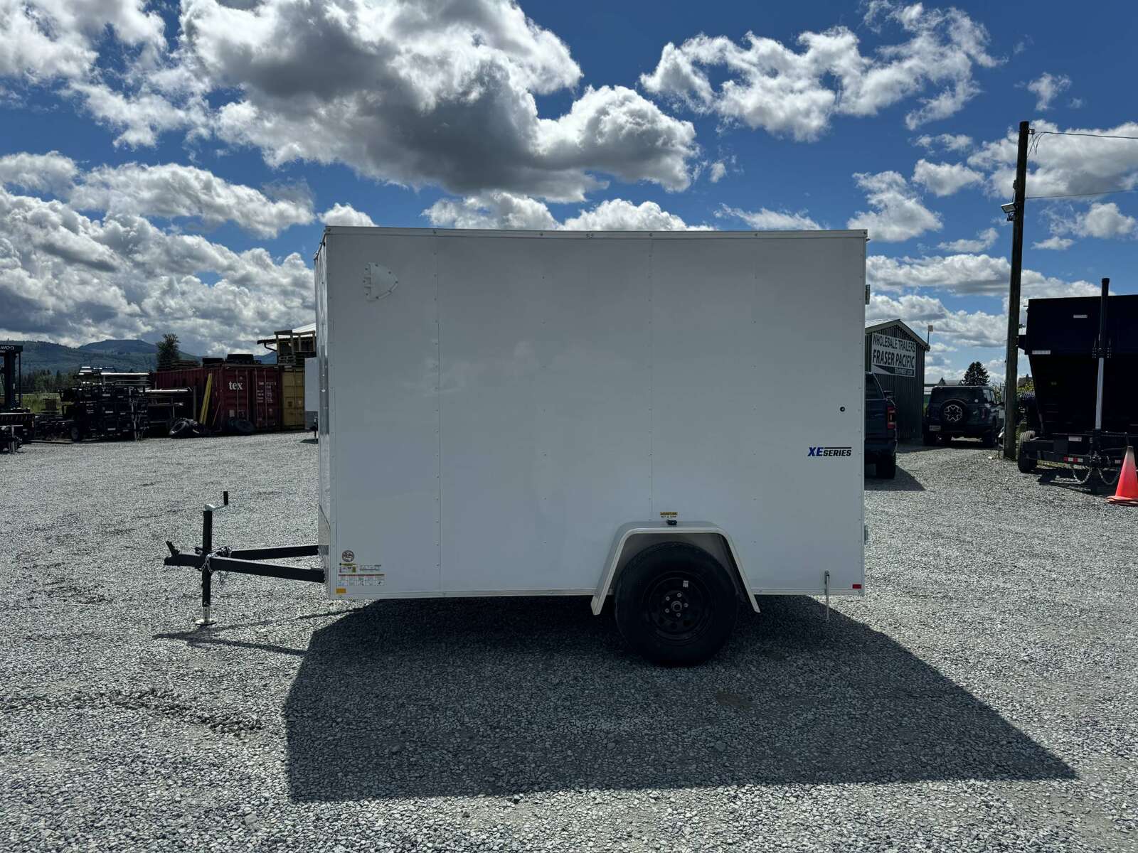 Photo of 2025 Mirage XE 6x10 V Nose Enclosed Cargo Trailer Barn Doors White Extra Height 2990lb GVW