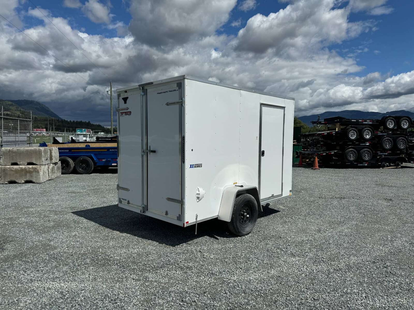 Photo of 2025 Mirage XE 6x10 V Nose Enclosed Cargo Trailer Barn Doors White Extra Height 2990lb GVW