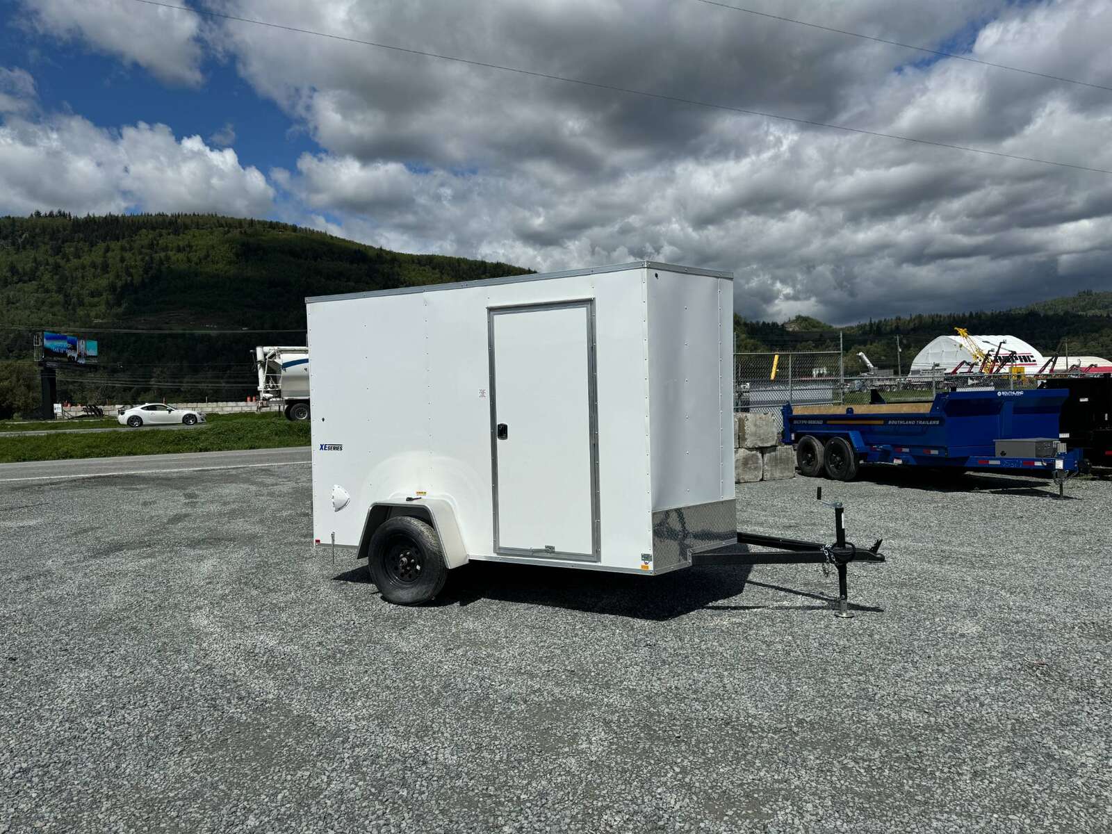 Photo of 2025 Mirage XE 6x10 V Nose Enclosed Cargo Trailer Barn Doors White Extra Height 2990lb GVW