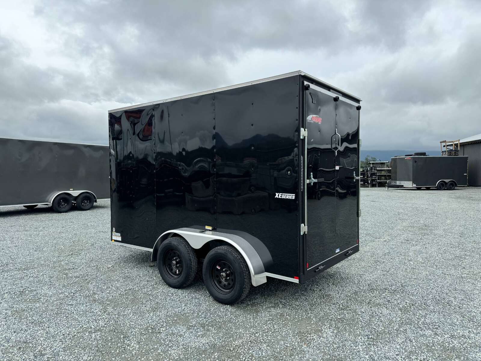 Photo of 2025 Mirage XE 6x12 V Nose Tandem Axle Cargo / Enclosed Trailer Black Ramp Door 77 Inch Interior Height 7,000lb GVW