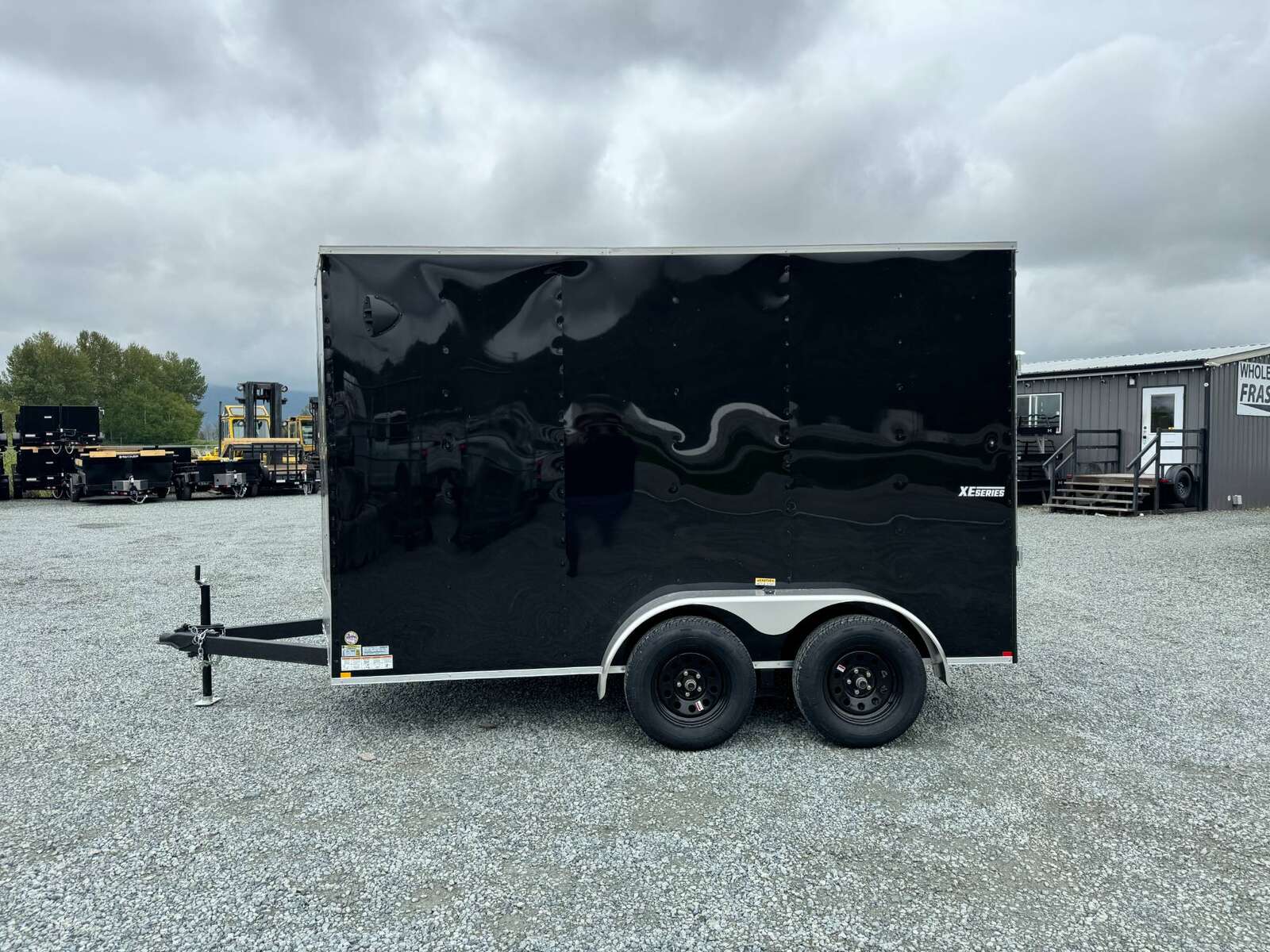 Photo of 2025 Mirage XE 6x12 V Nose Tandem Axle Cargo / Enclosed Trailer Black Ramp Door 77 Inch Interior Height 7,000lb GVW