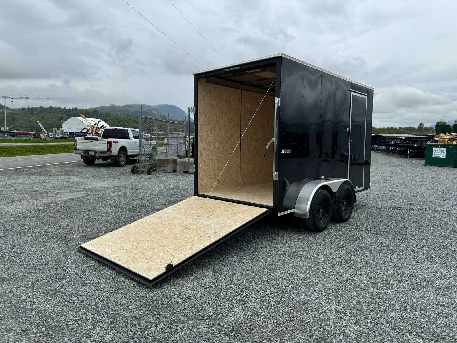 Photo of 2025 Mirage XE 6x12 V Nose Tandem Axle Cargo / Enclosed Trailer Black Ramp Door 77 Inch Interior Height 7,000lb GVW