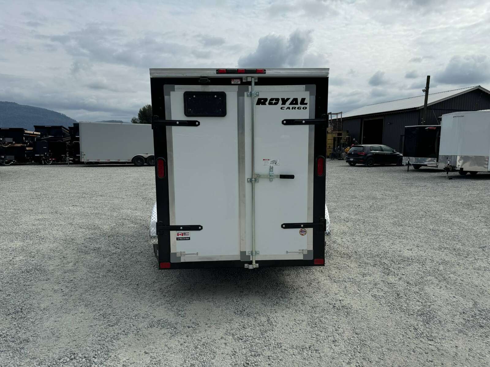 Photo of 2025 Royal Cargo 5x10 Cargo Enclosed Trailer V Nose Barn Doors White Side Door