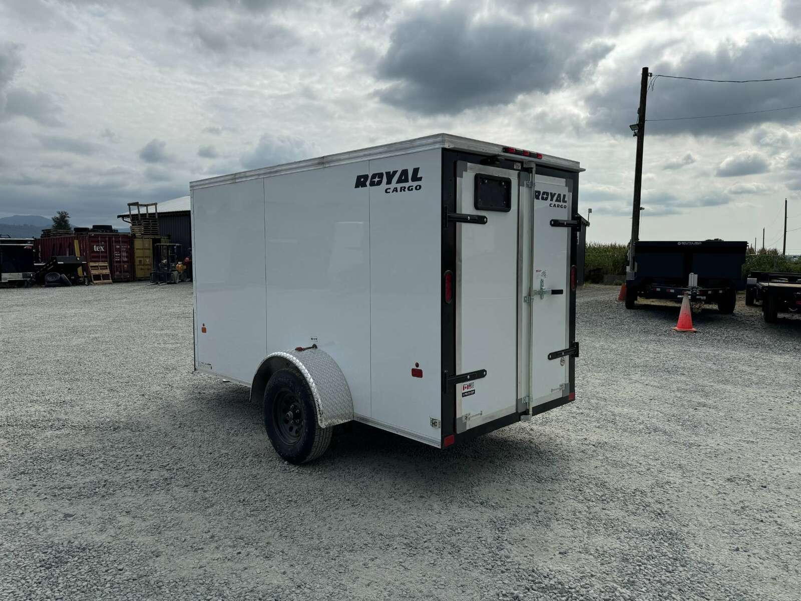 Photo of 2025 Royal Cargo 5x10 Cargo Enclosed Trailer V Nose Barn Doors White Side Door