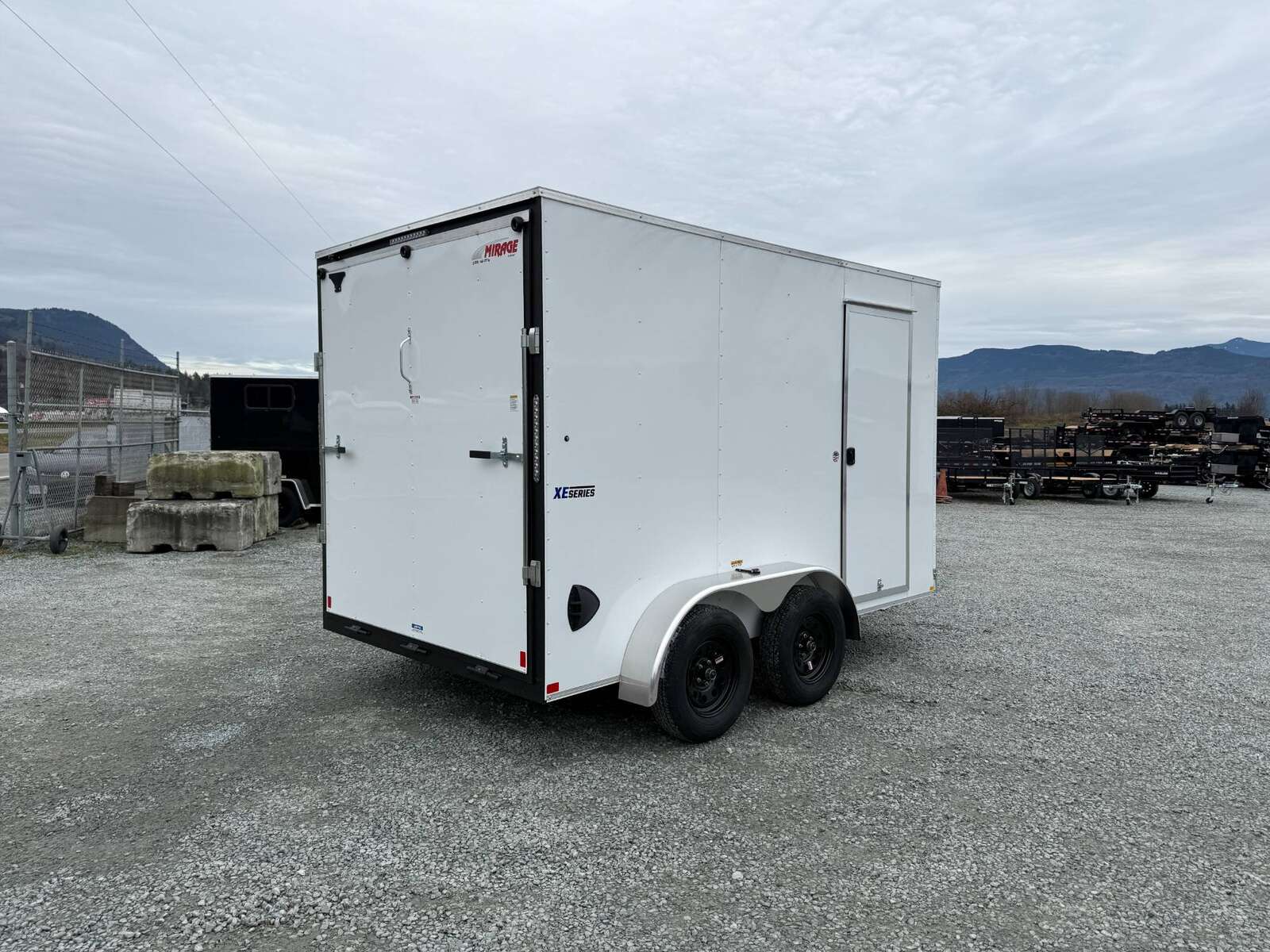 Photo of 2025 Mirage XE 7X12 V-Nose Ramp Door Cargo / Enclosed Trailer Extra Height White 7000lb GVW