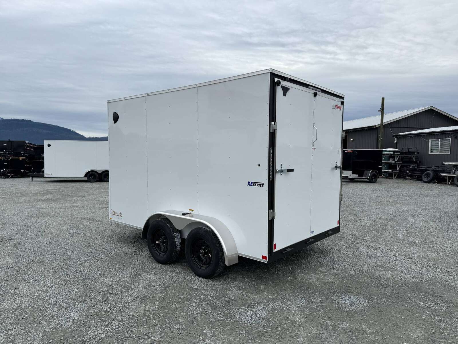 Photo of 2025 Mirage XE 7X12 V-Nose Ramp Door Cargo / Enclosed Trailer Extra Height White 7000lb GVW