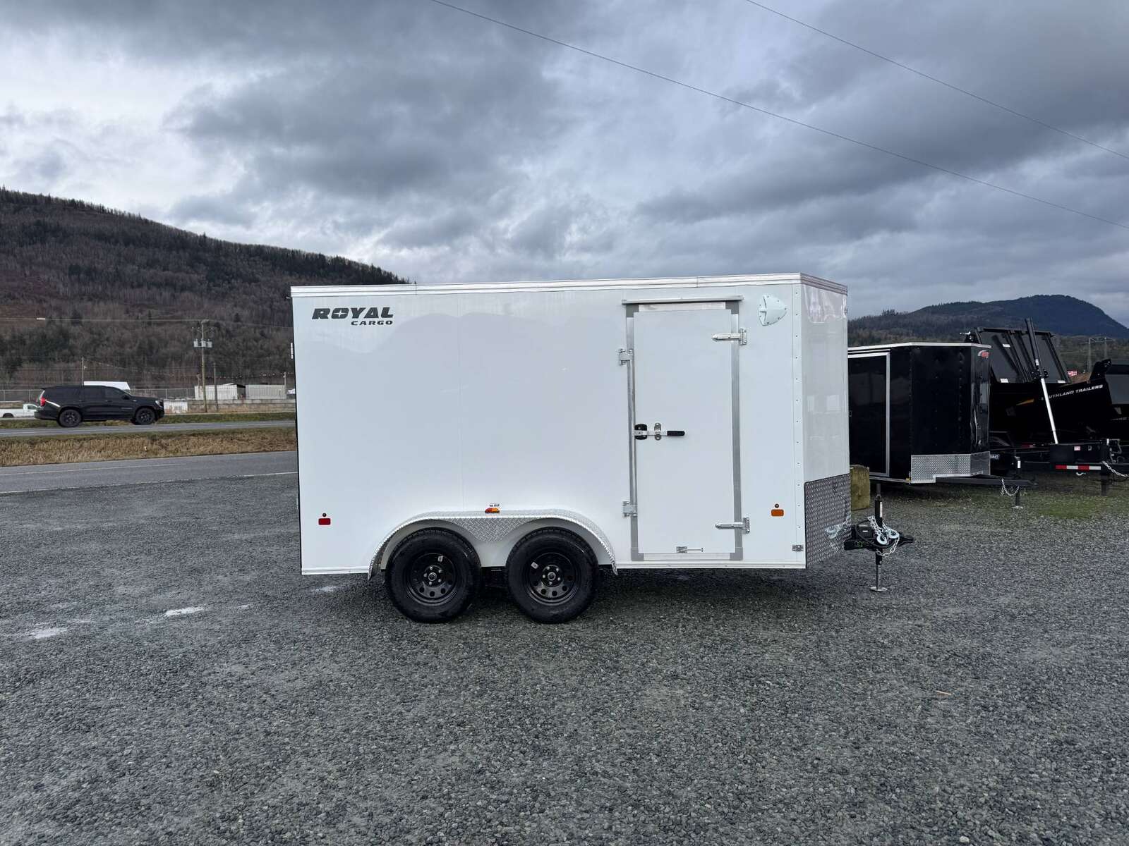 Photo of 2025 Royal Cargo 6x12 V Nose Cargo / Enclosed Trailer Ramp Door White Tandem Axle 7700lb GVW