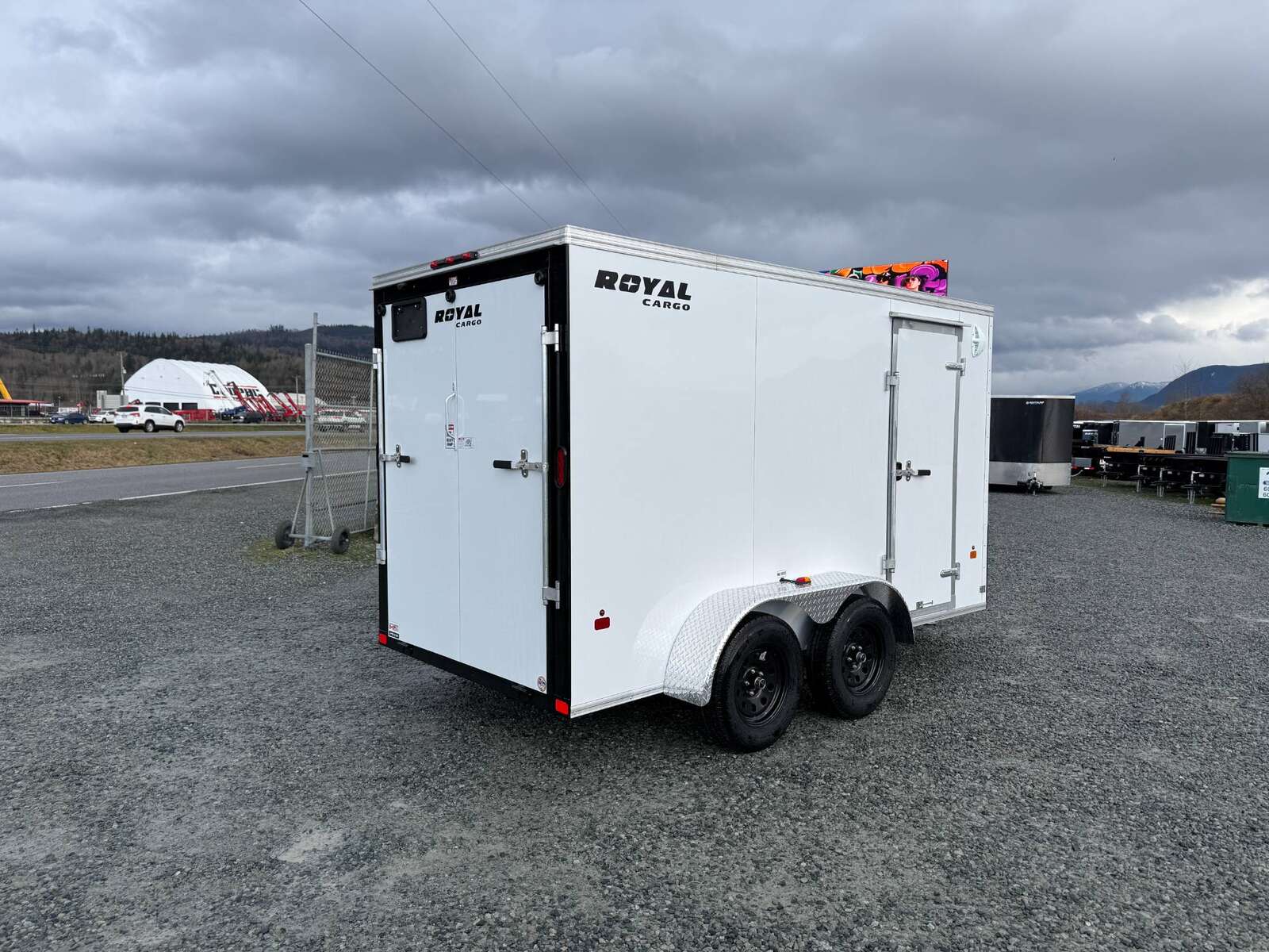 Photo of 2025 Royal Cargo 6x12 V Nose Cargo / Enclosed Trailer Ramp Door White Tandem Axle 7700lb GVW