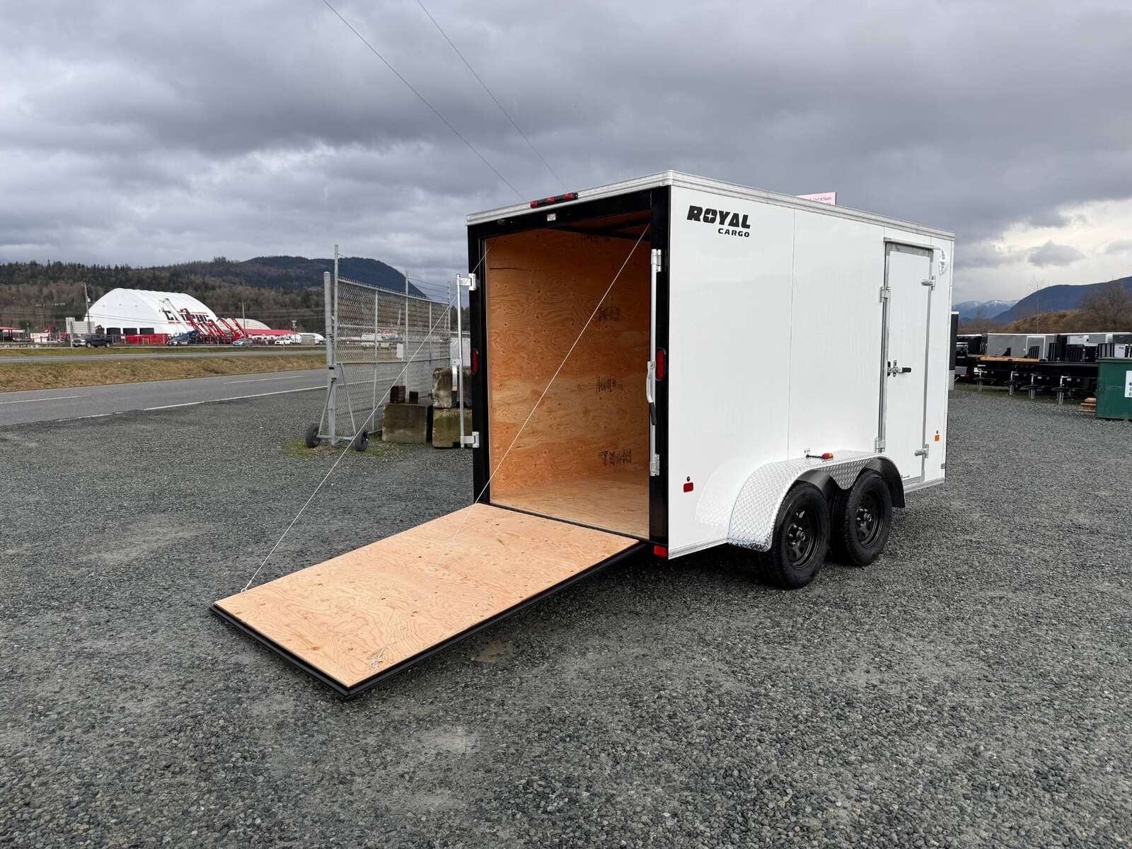 Photo of 2025 Royal Cargo 6x12 V Nose Cargo / Enclosed Trailer Ramp Door White Tandem Axle 7700lb GVW