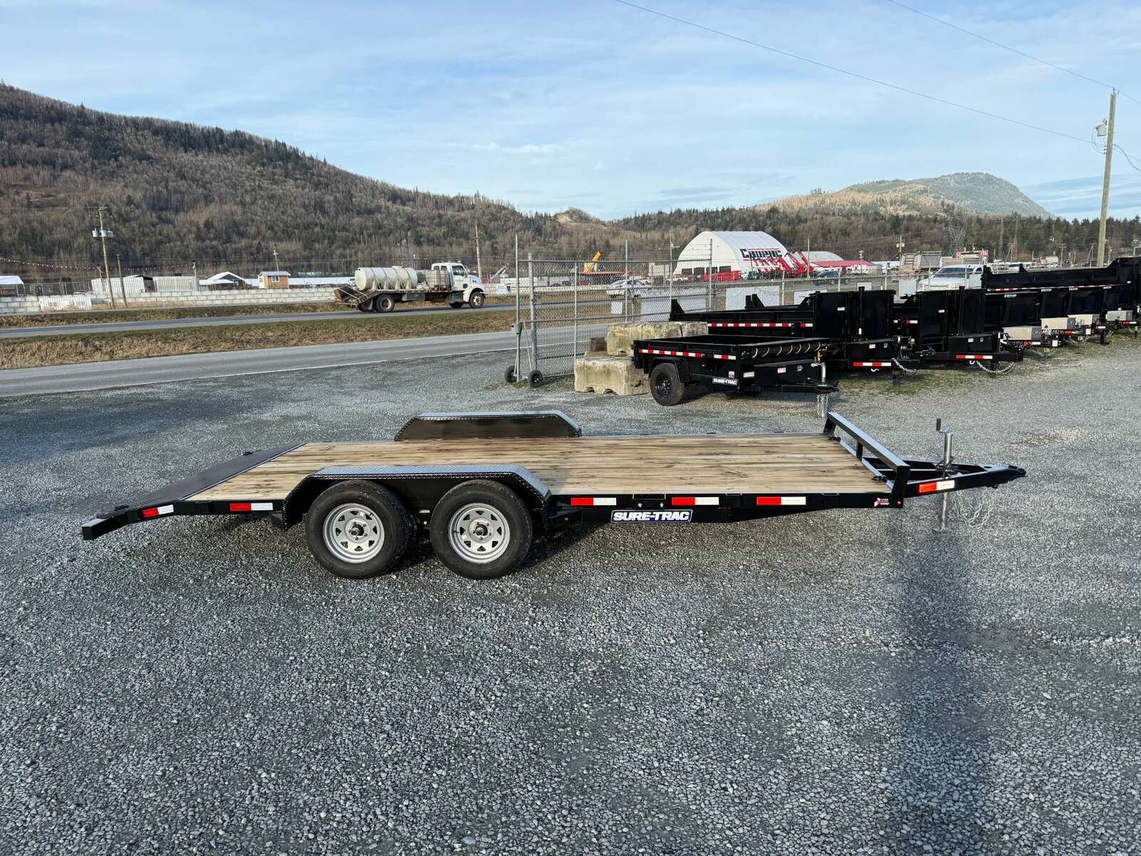 Photo of 2025 Suretrac 7x18 Car Hauler Flat Deck Trailer W/ Dovetail & Slide In Ramps 7000lb GVW