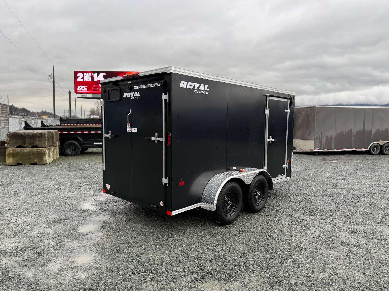 Photo of 2025 Royal Cargo 6x12 Tandem Axle Cargo / Enclosed Trailer Flat Front Black Rear Ramp Door 7700lb GVW