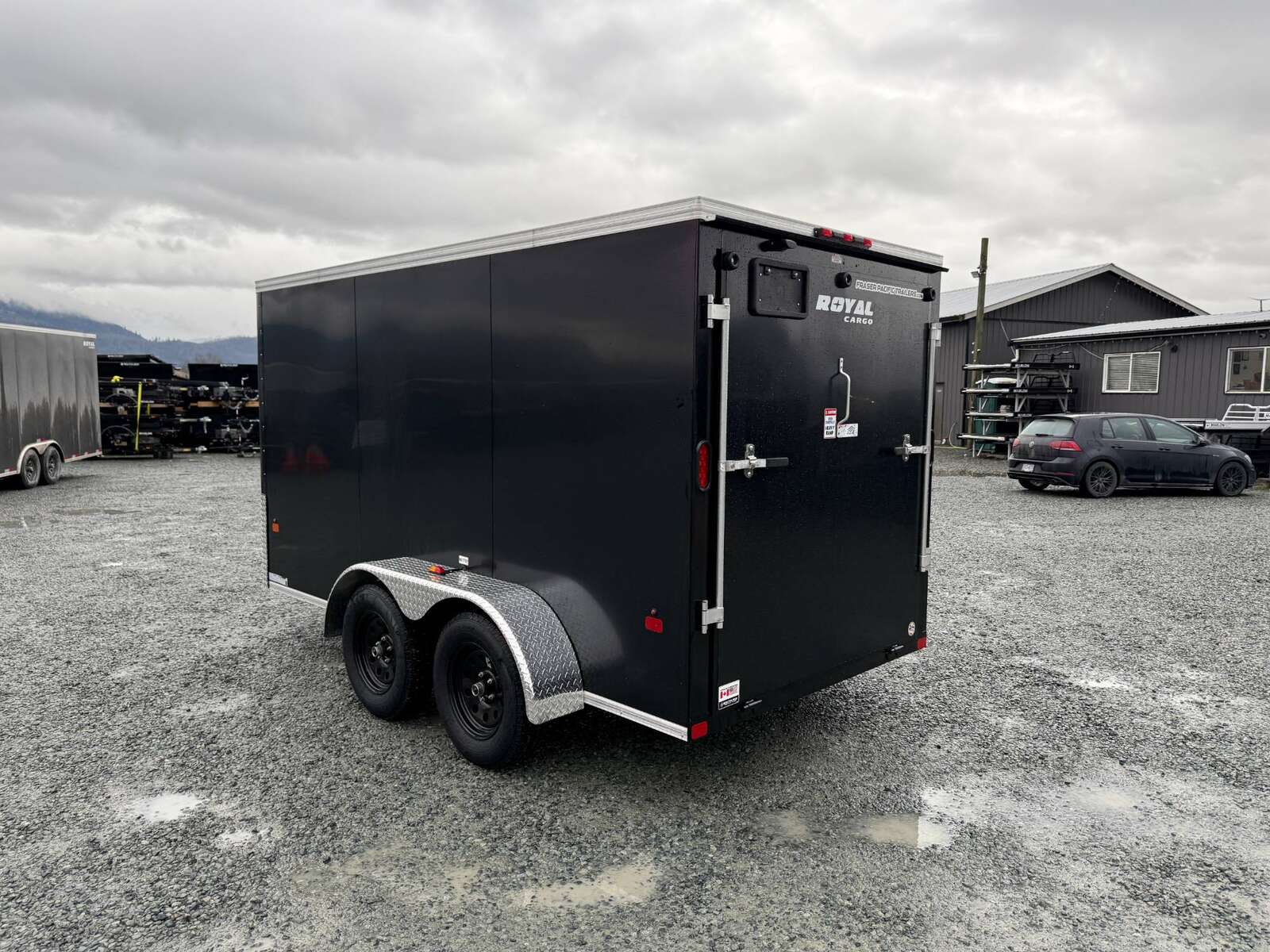 Photo of 2025 Royal Cargo 6x12 Tandem Axle Cargo / Enclosed Trailer Flat Front Black Rear Ramp Door 7700lb GVW