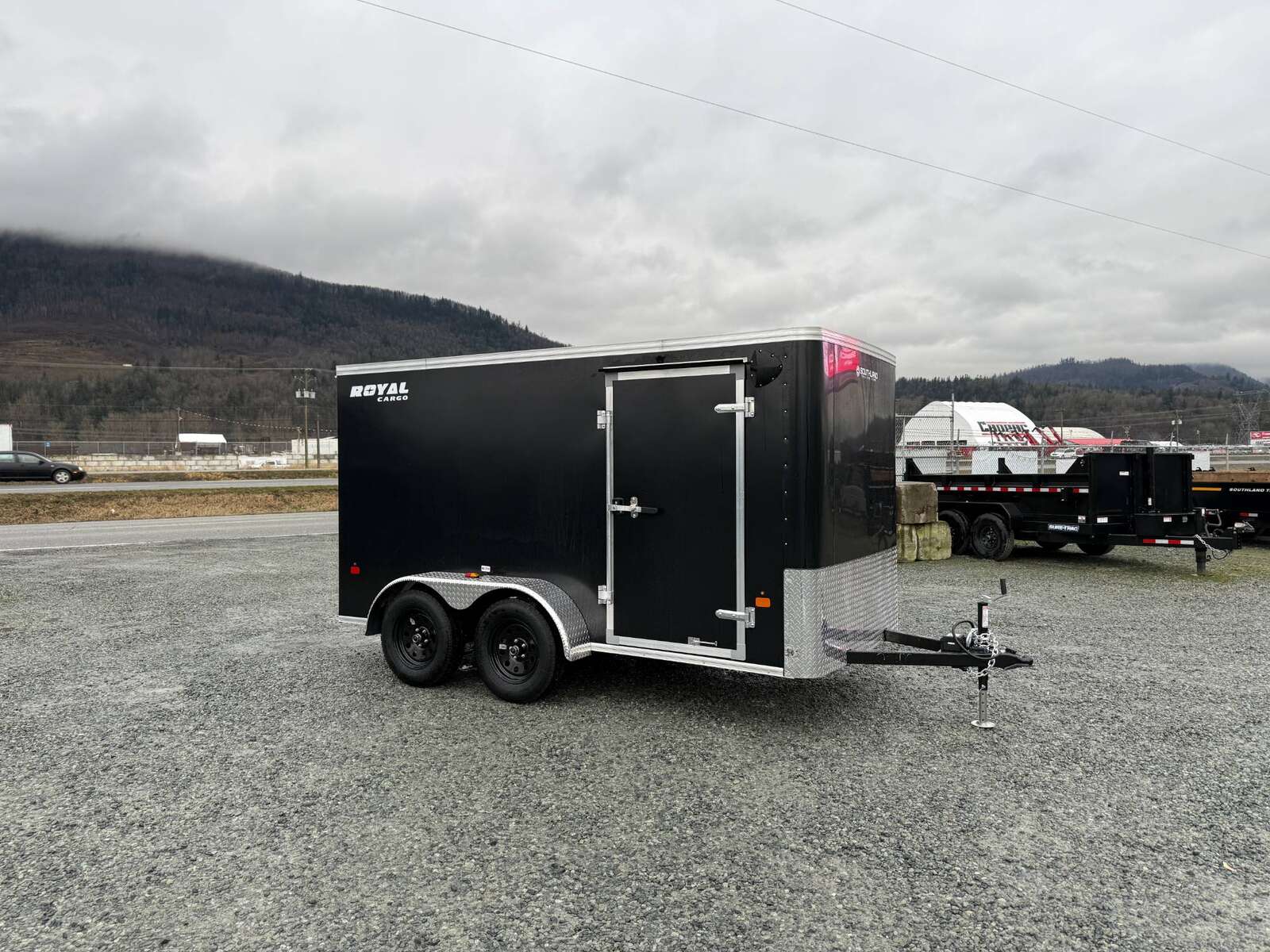 Photo of 2025 Royal Cargo 6x12 Tandem Axle Cargo / Enclosed Trailer Flat Front Black Rear Ramp Door 7700lb GVW