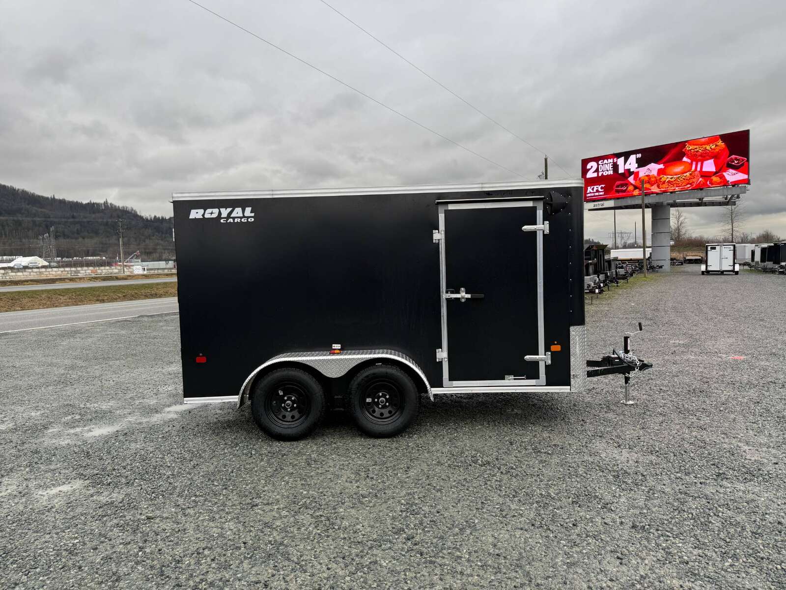 Photo of 2025 Royal Cargo 6x12 Tandem Axle Cargo / Enclosed Trailer Flat Front Black Rear Ramp Door 7700lb GVW