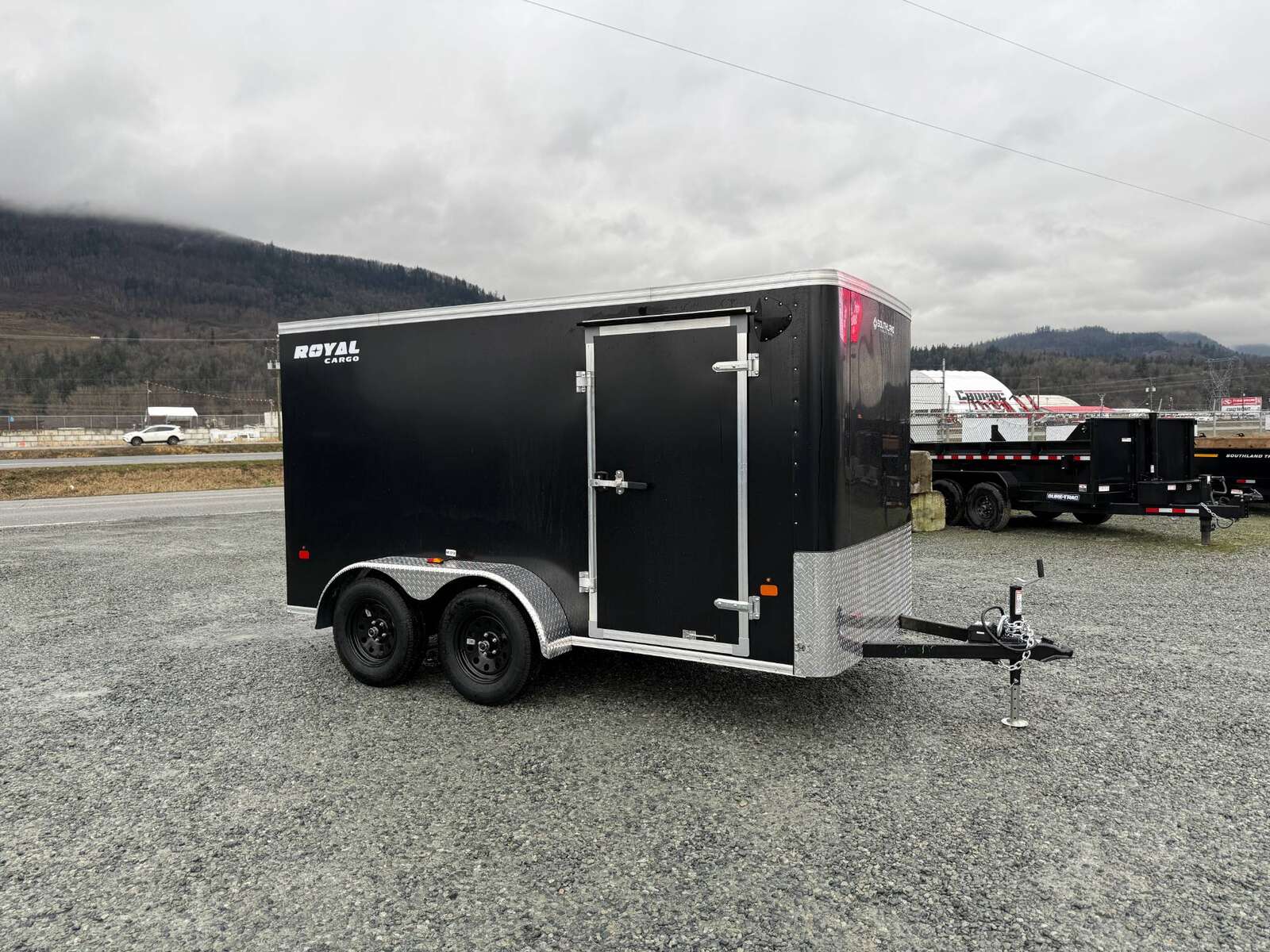 Photo of 2025 Royal Cargo 6x12 Tandem Axle Cargo / Enclosed Trailer Flat Front Black Rear Ramp Door 7700lb GVW