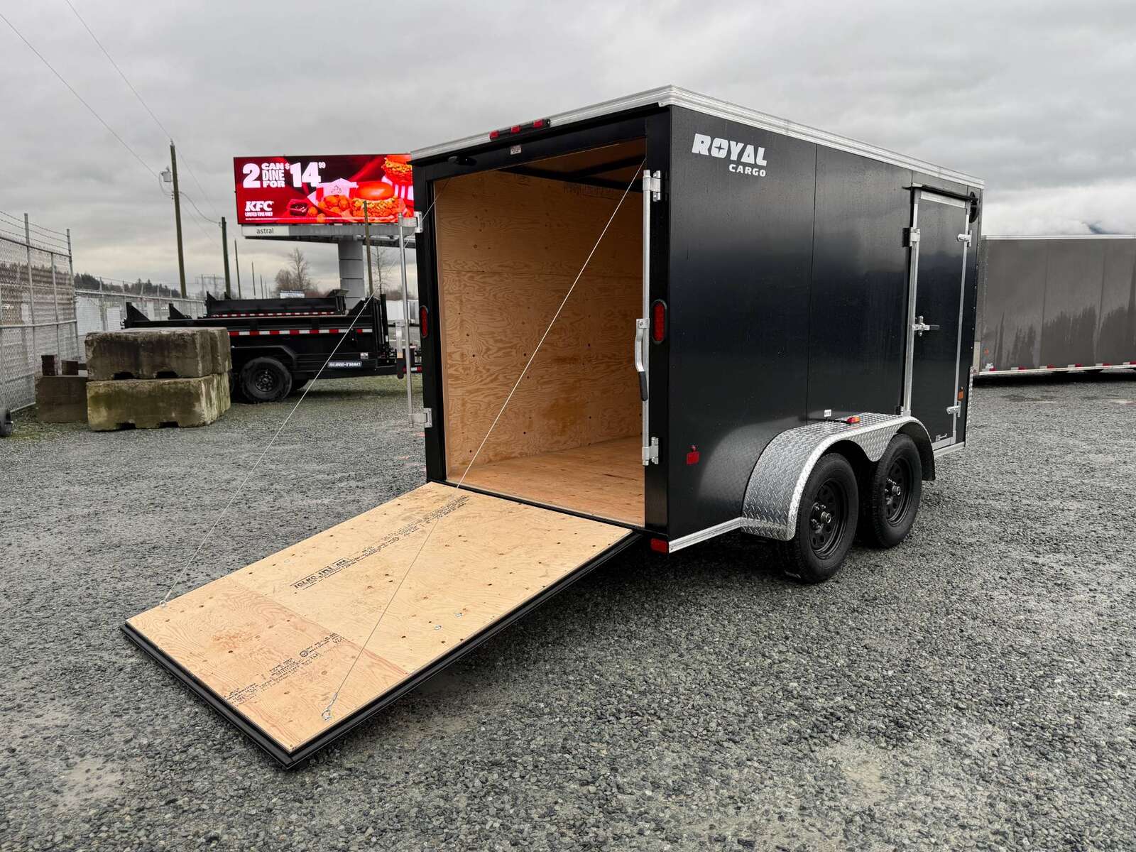 Photo of 2025 Royal Cargo 6x12 Tandem Axle Cargo / Enclosed Trailer Flat Front Black Rear Ramp Door 7700lb GVW