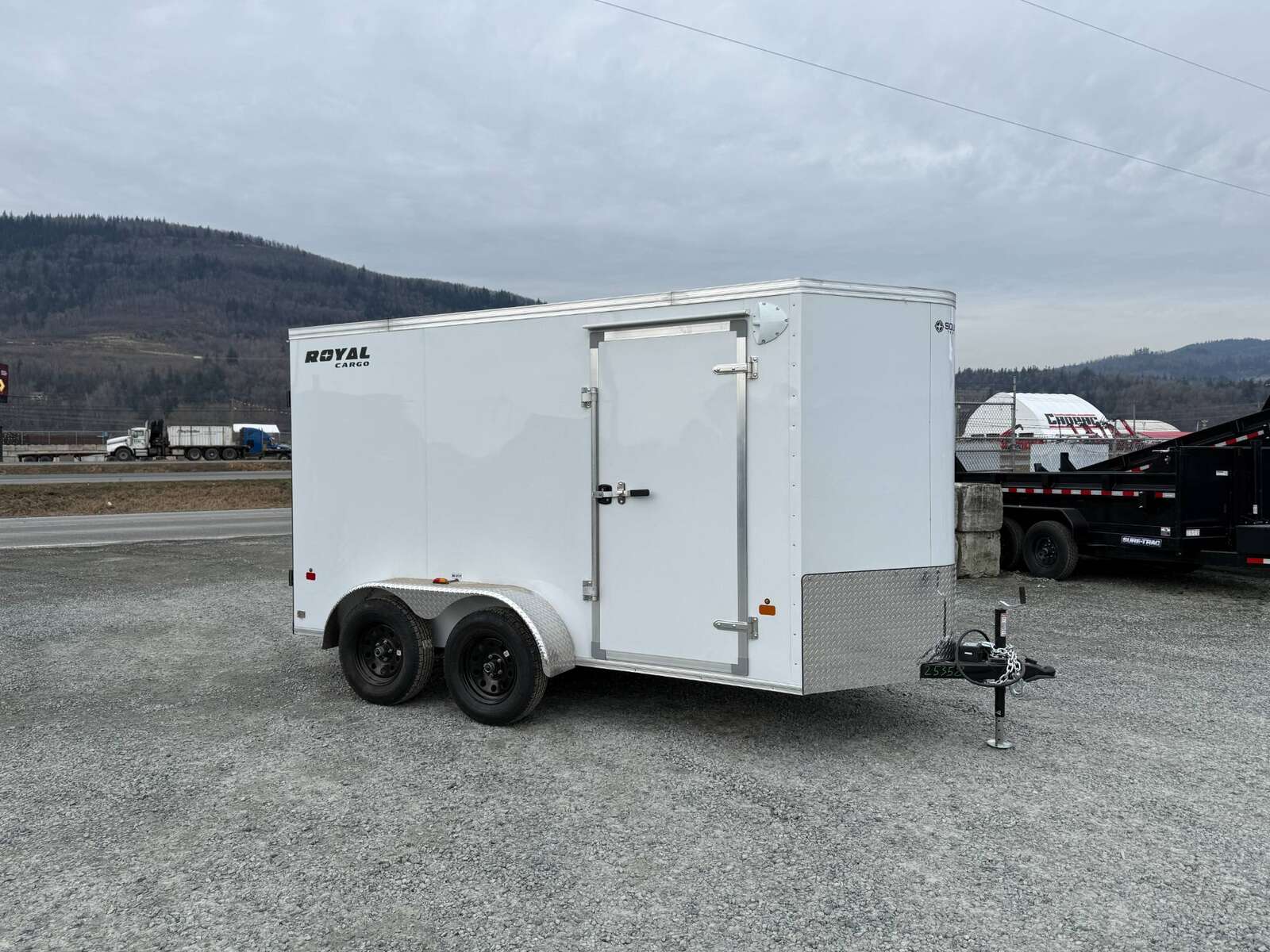 Photo of 2025 Royal Cargo 6x12 Enclosed Trailer Tandem Axle Rear Barn Doors White 7700lbs GVW