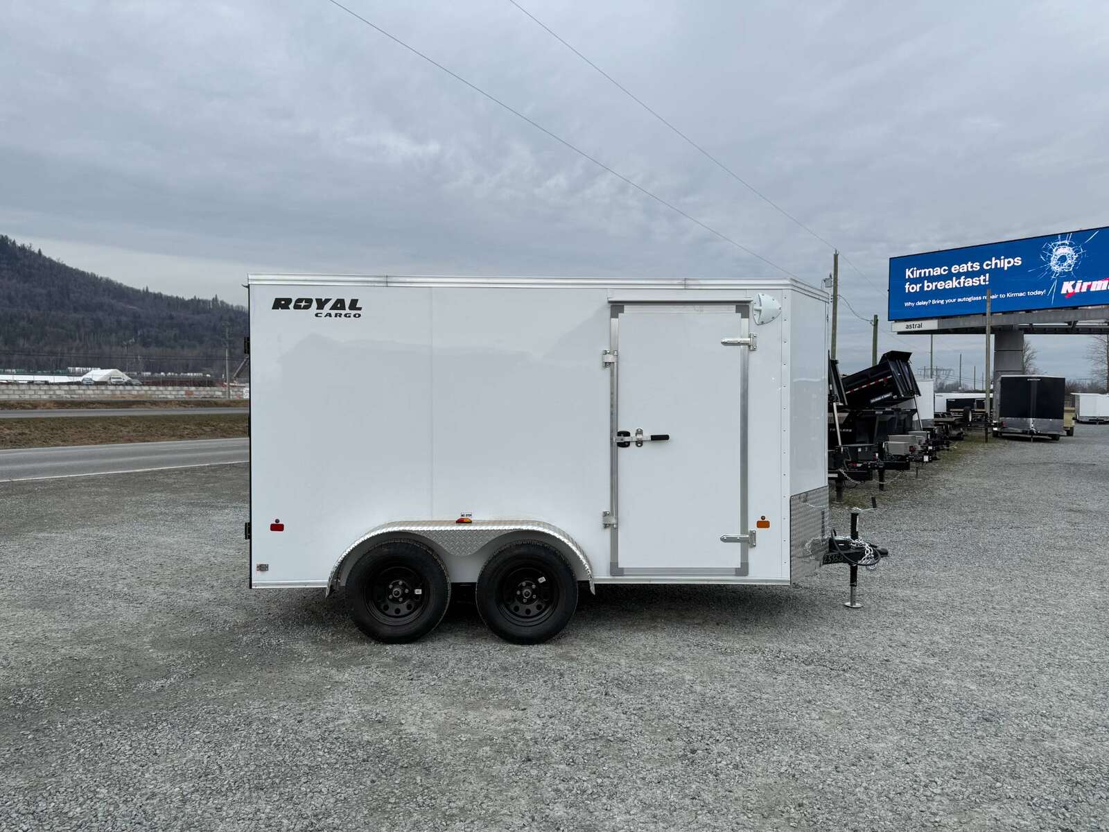 Photo of 2025 Royal Cargo 6x12 Enclosed Trailer Tandem Axle Rear Barn Doors White 7700lbs GVW