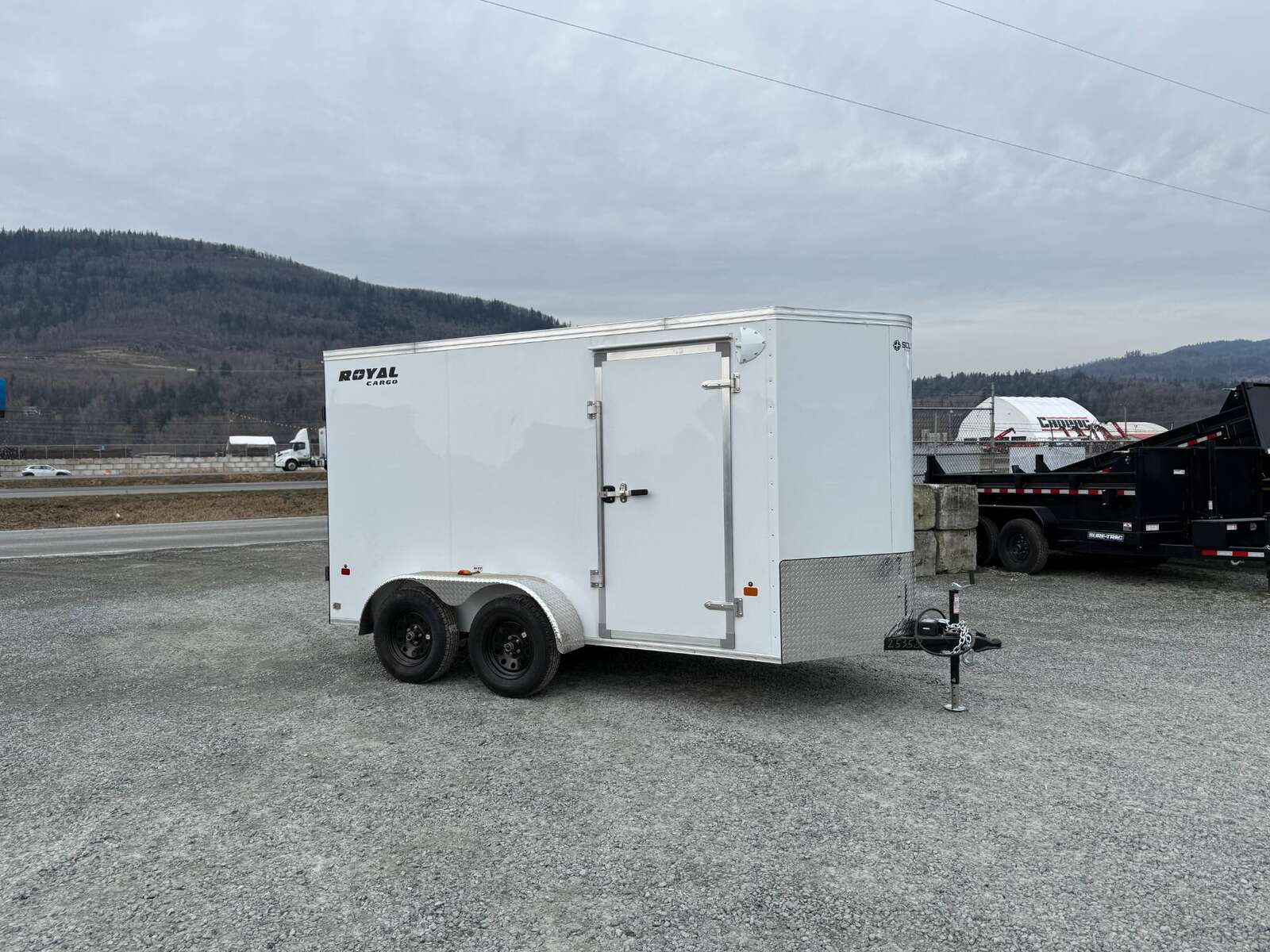 Photo of 2025 Royal Cargo 6x12 Enclosed Trailer Tandem Axle Rear Barn Doors White 7700lbs GVW