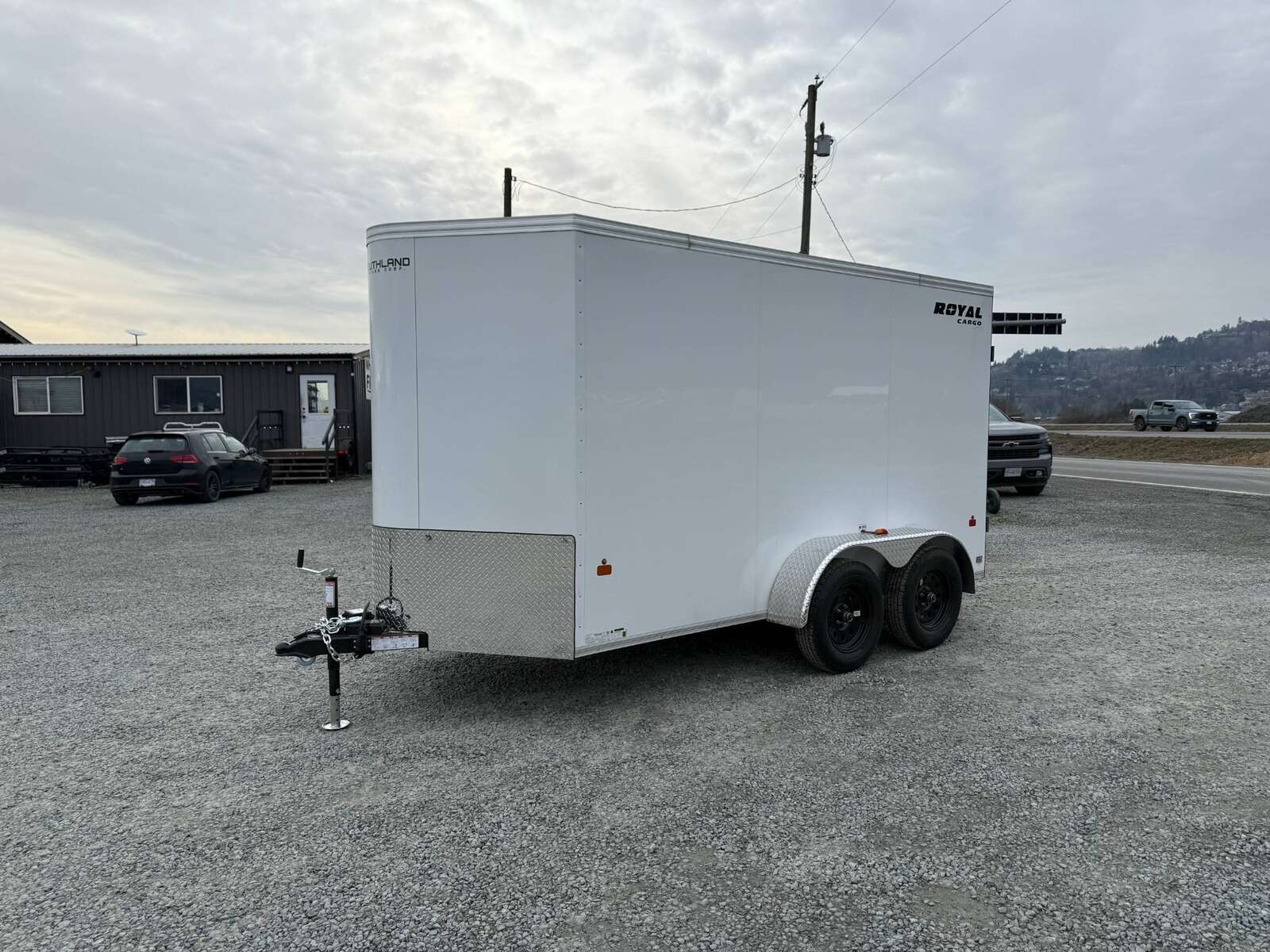 Photo of 2025 Royal Cargo 6x12 Enclosed Trailer Tandem Axle Rear Barn Doors White 7700lbs GVW