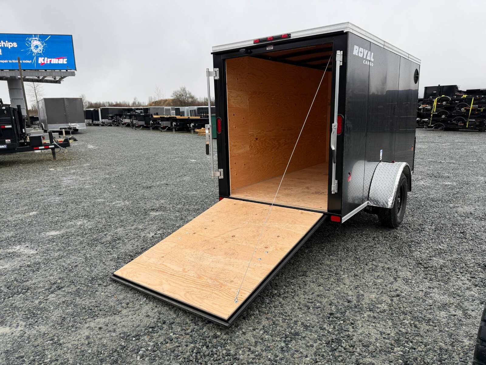 Photo of 2025 Royal Cargo 5x10 Enclosed Cargo Trailer V Nose Black Ramp Door