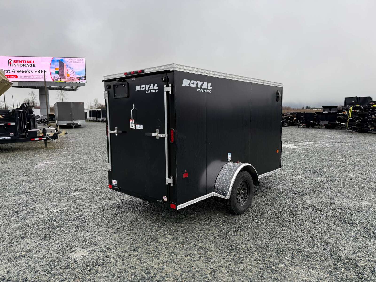 Photo of 2025 Royal Cargo 5x10 Enclosed Cargo Trailer V Nose Black Ramp Door