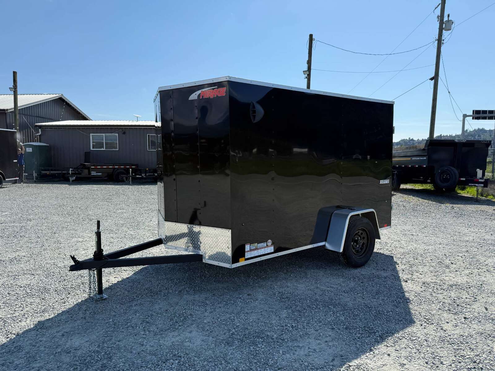 Photo of 2025 Mirage XE 6x10 Enclosed Cargo Trailer V Nose Barn Doors Black Standard Height 2990lb GVW