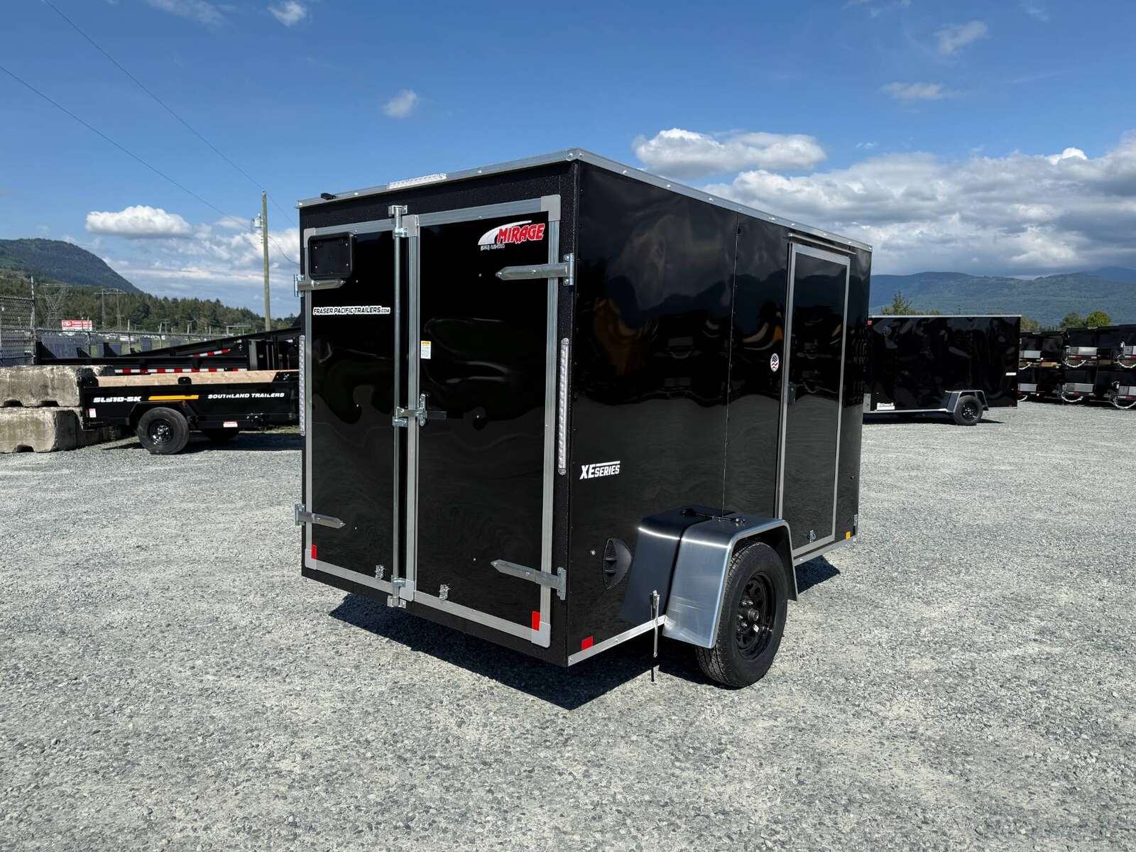 Photo of 2025 Mirage XE 6x10 Enclosed Cargo Trailer V Nose Barn Doors Black Standard Height 2990lb GVW