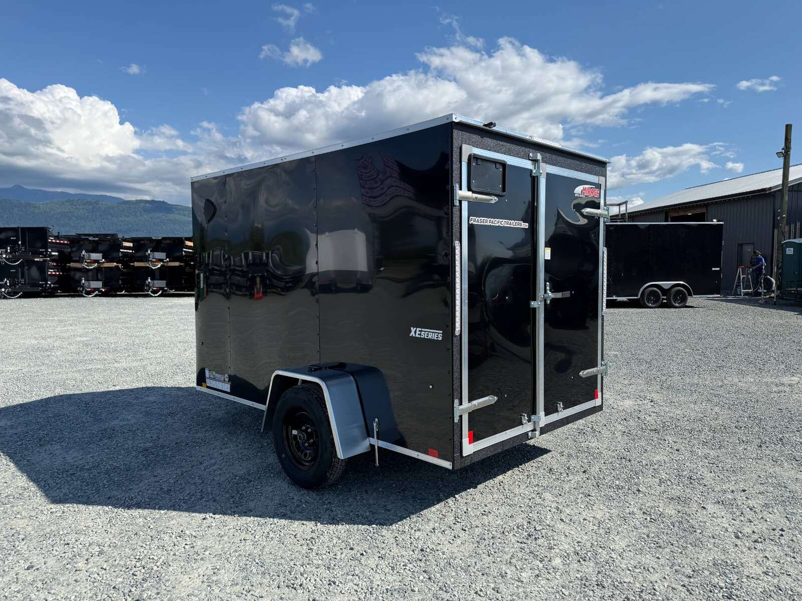 Photo of 2025 Mirage XE 6x10 Enclosed Cargo Trailer V Nose Barn Doors Black Standard Height 2990lb GVW