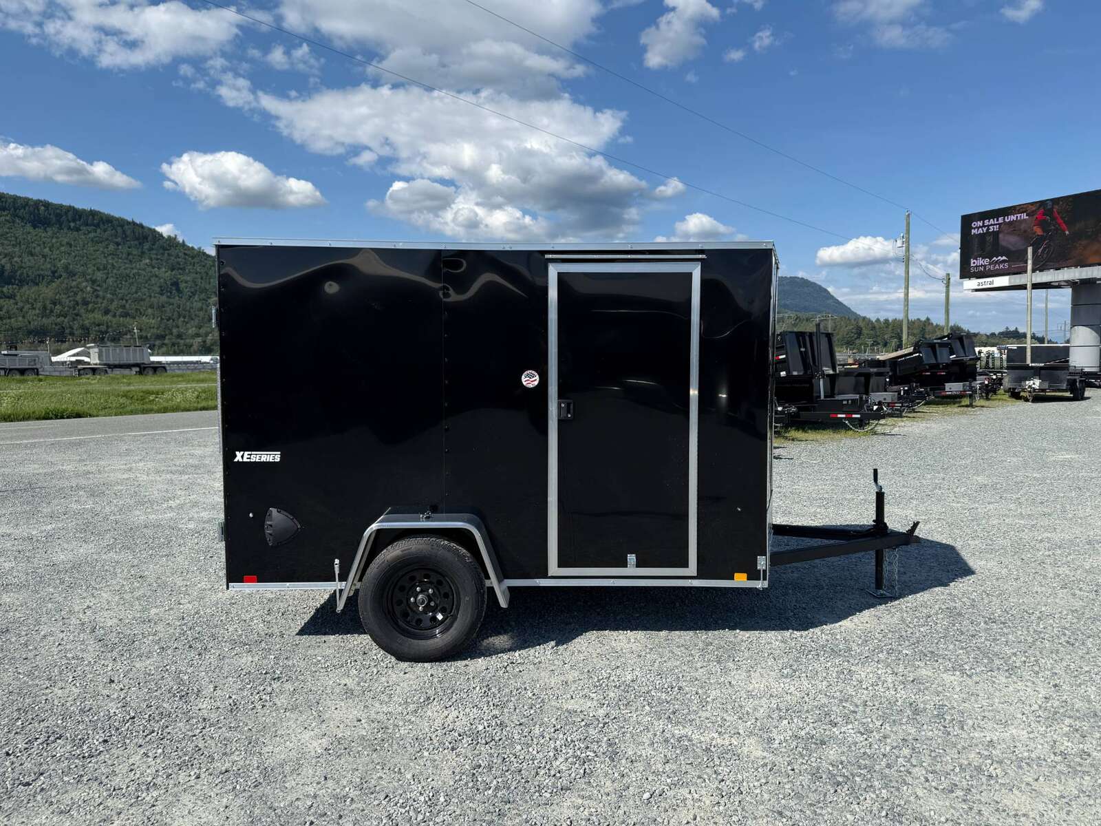 Photo of 2025 Mirage XE 6x10 Enclosed Cargo Trailer V Nose Barn Doors Black Standard Height 2990lb GVW