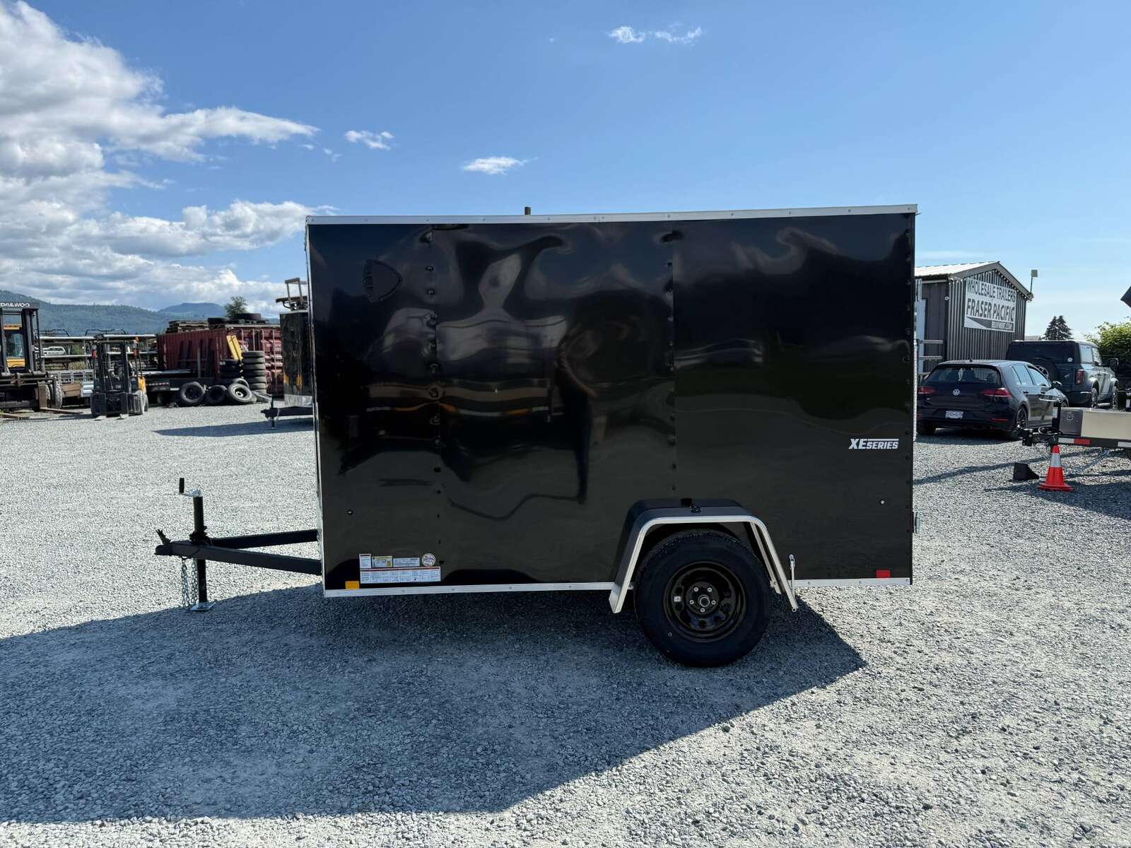 Photo of 2025 Mirage XE 6x10 Enclosed Cargo Trailer V Nose Barn Doors Black Standard Height 2990lb GVW