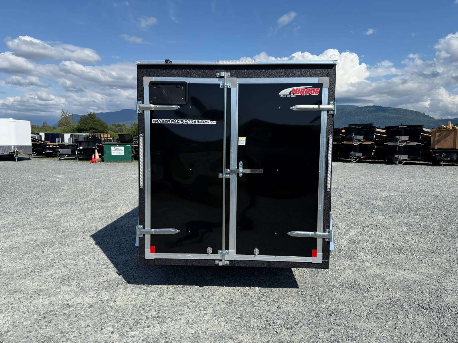 Photo of 2025 Mirage XE 6x10 Enclosed Cargo Trailer V Nose Barn Doors Black Standard Height 2990lb GVW