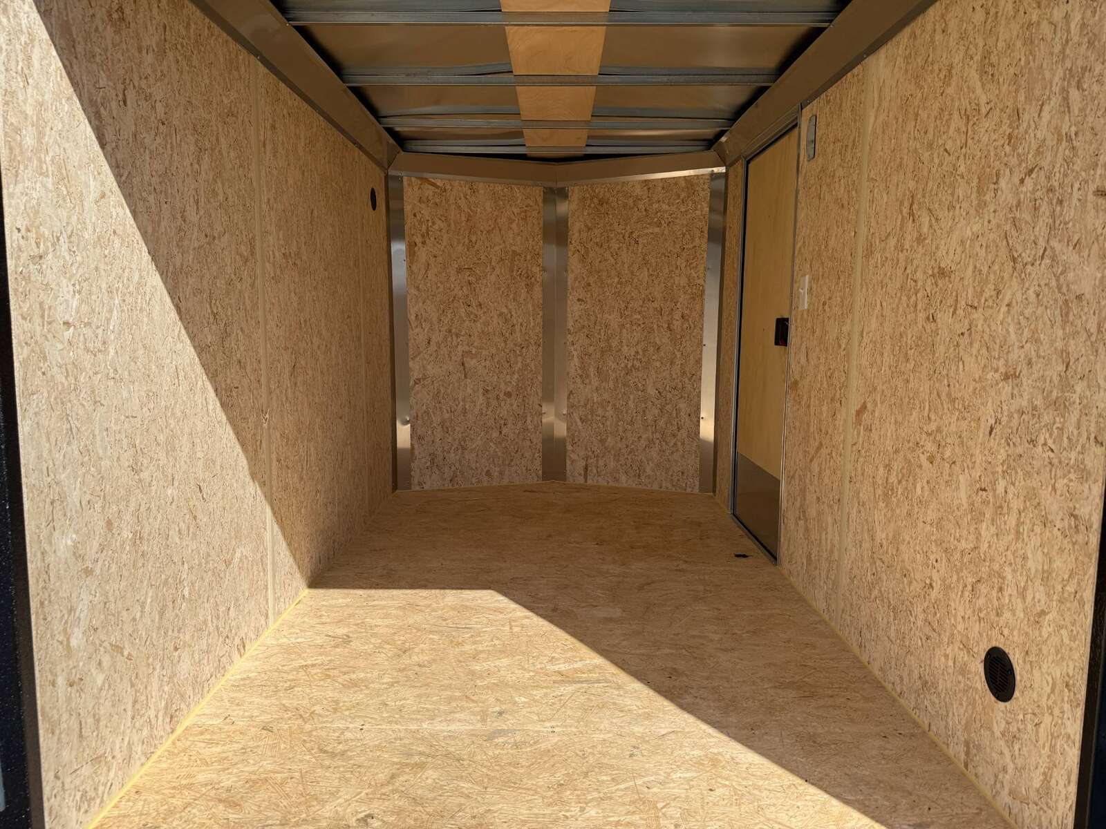 Photo of 2025 Mirage XE 6x10 Enclosed Cargo Trailer V Nose Barn Doors Black Standard Height 2990lb GVW