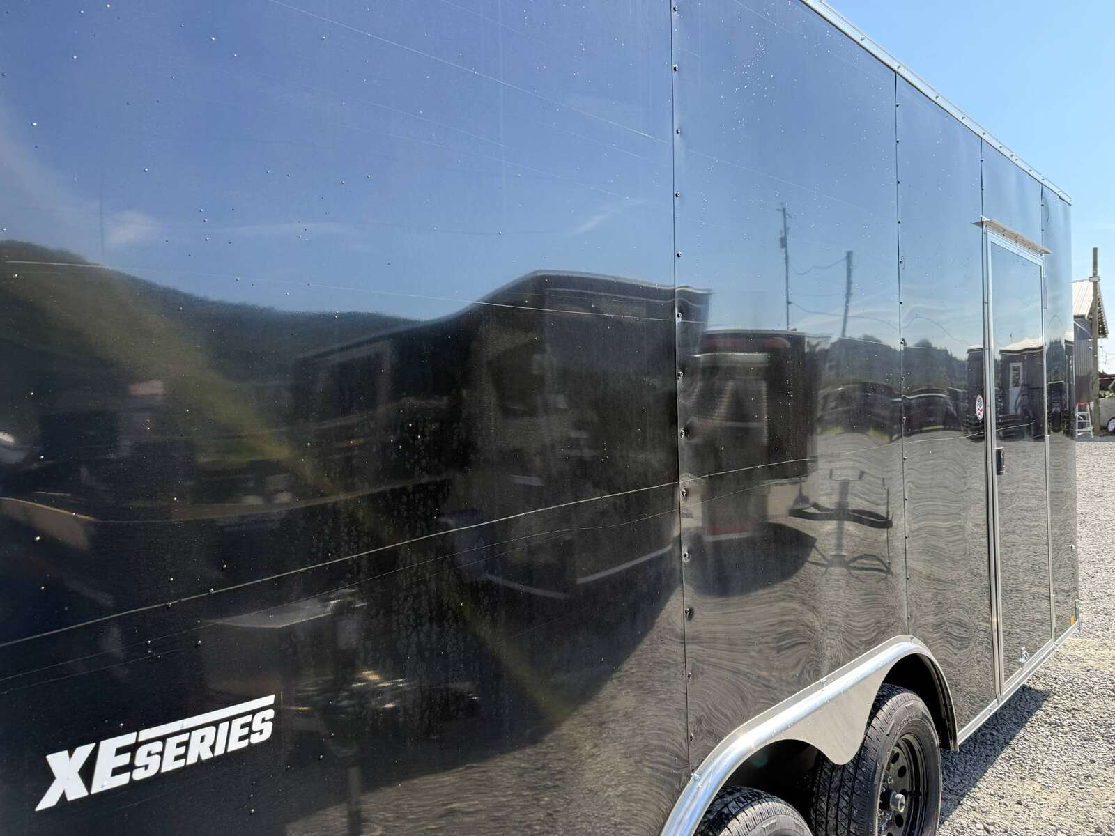 Photo of **SCRATCH SPECIAL** 2025 Mirage XE 8.5x16 V Nose Extra Height Cargo / Enclosed Trailer Ramp Door Black 7000lb GVW