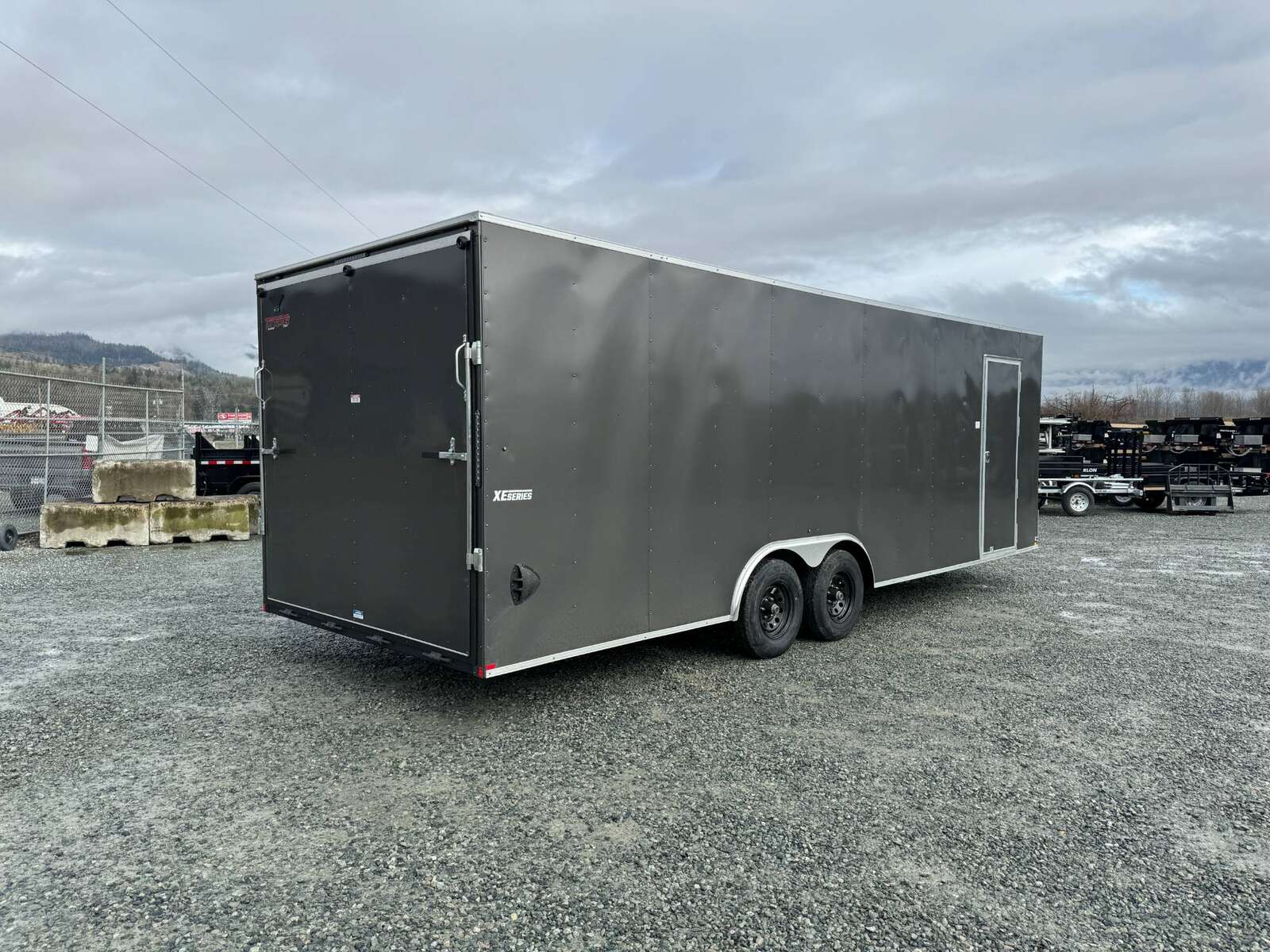 Photo of 2025 Mirage XE 8.5x24 V Nose Cargo / Enclosed Trailer Extra Height Ramp Door Charcoal Grey 9900lb GVW
